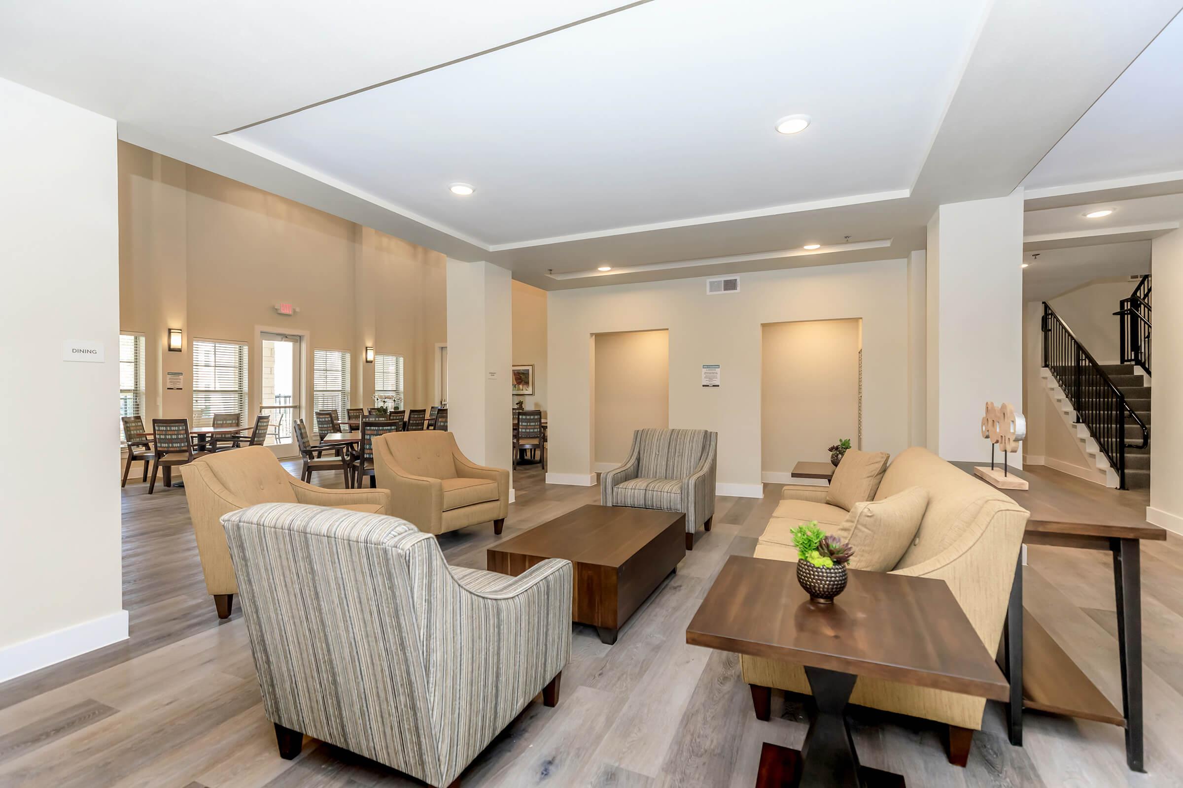 a living room filled with furniture and a table