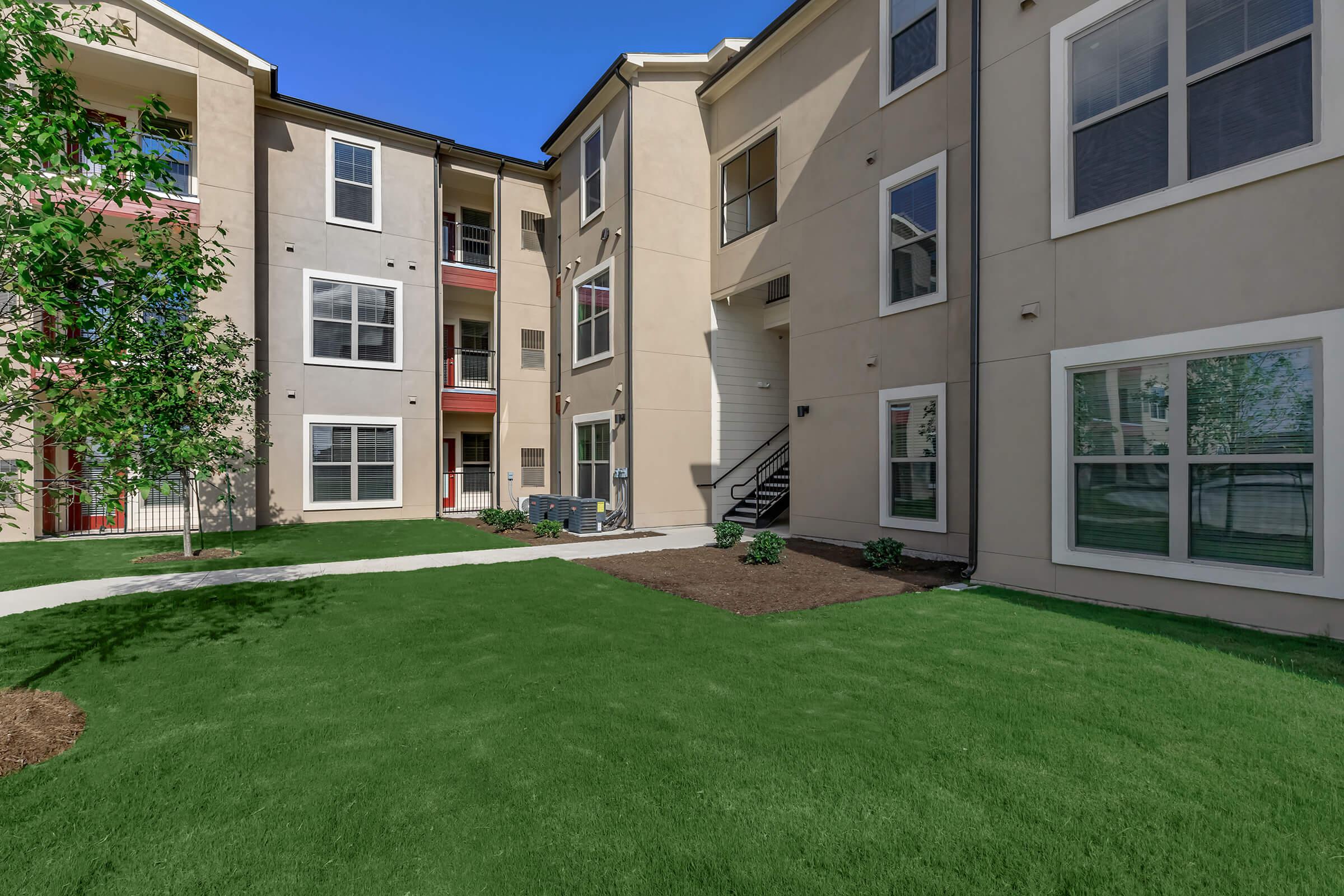 a large lawn in front of a building