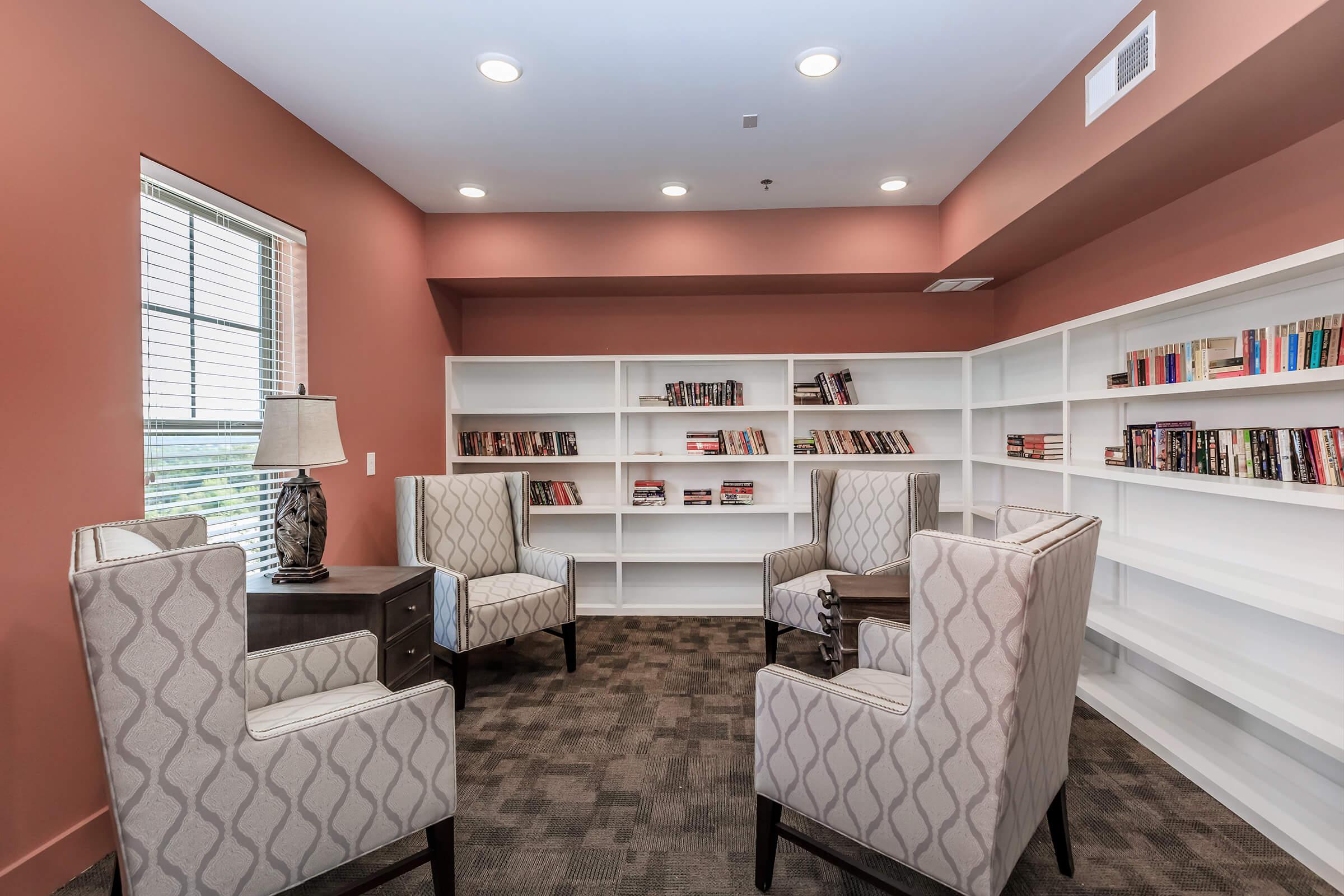 a room filled with furniture and a large window