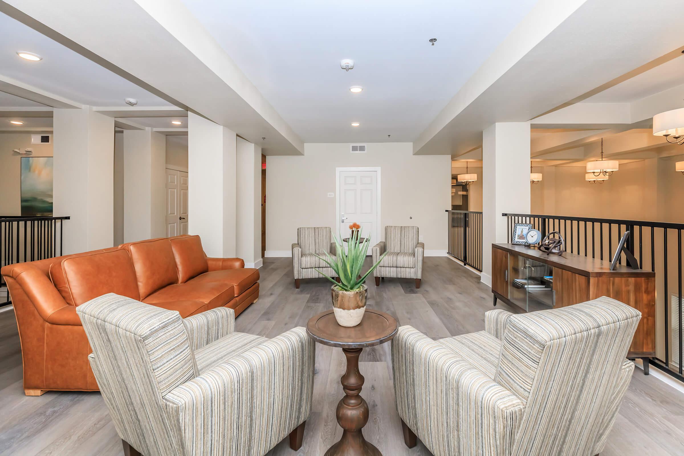 a living room filled with furniture and a flat screen tv