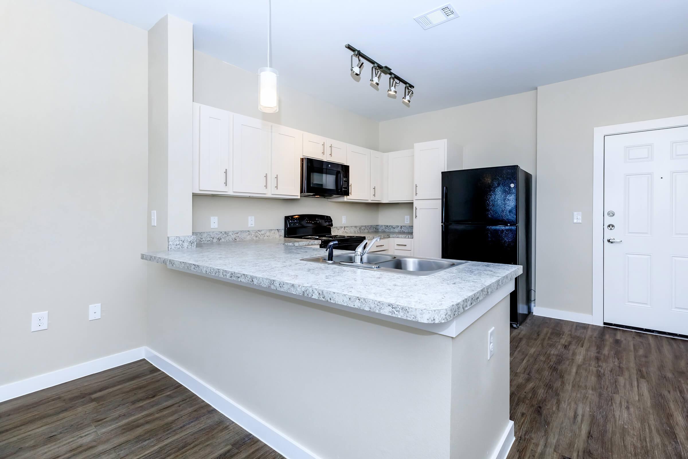 Apartments for Rent in Leander TX - Hills at Leander Spacious Kitchen with Plenty of Counterspace, Fully Equipped with Black Appliances, and Much More