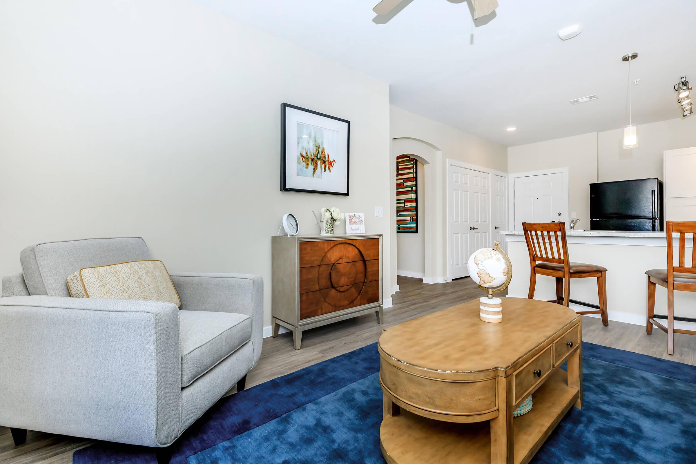 a living room filled with lots of furniture