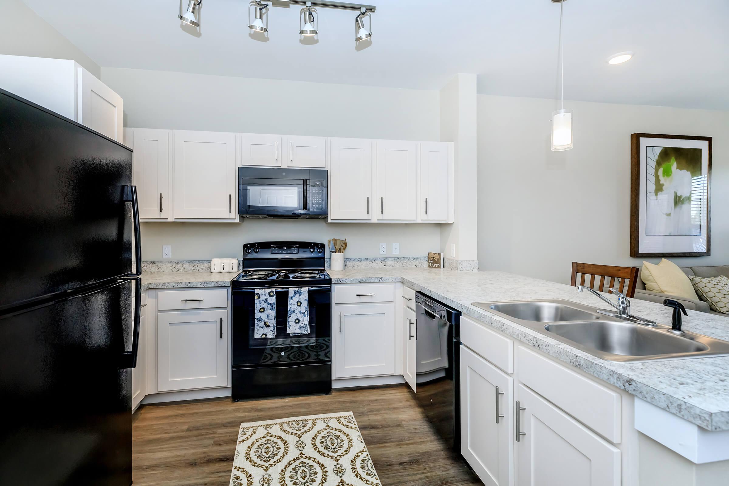 a kitchen with a stove and a sink