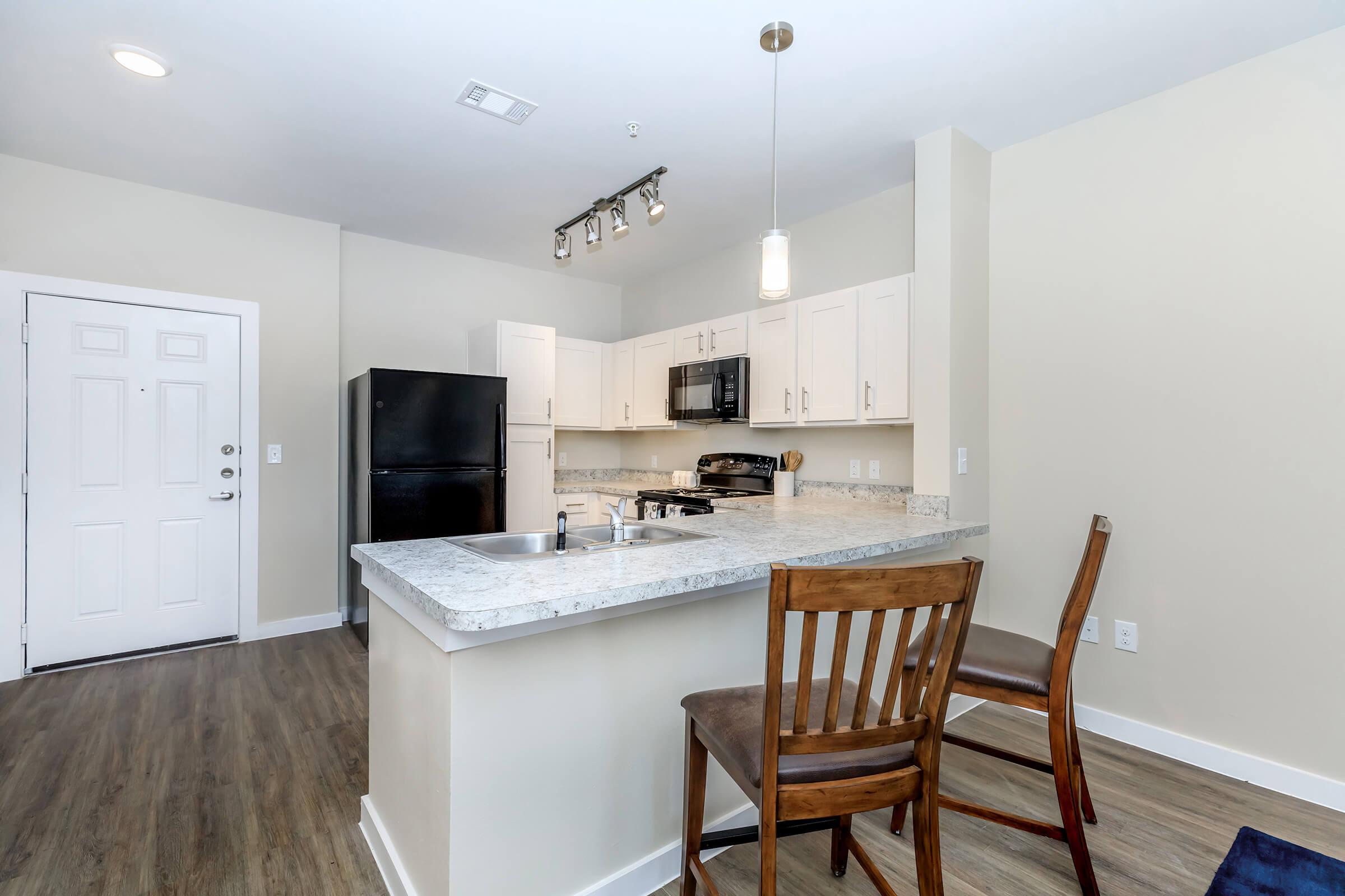 a kitchen with a dining room table