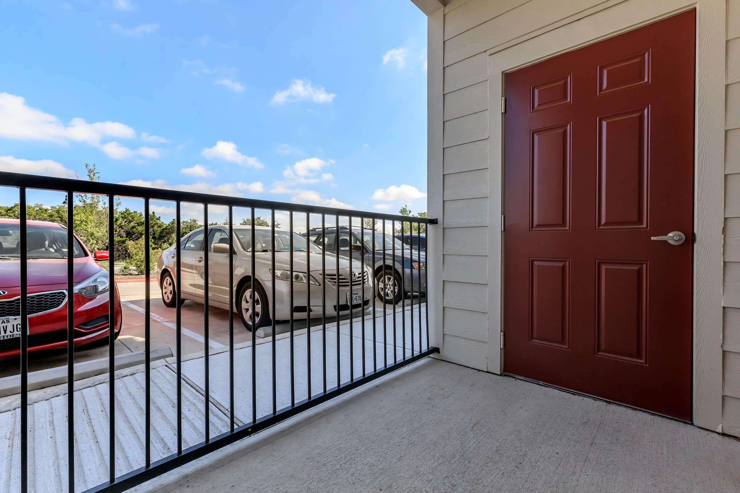 a double door on the side of a fence