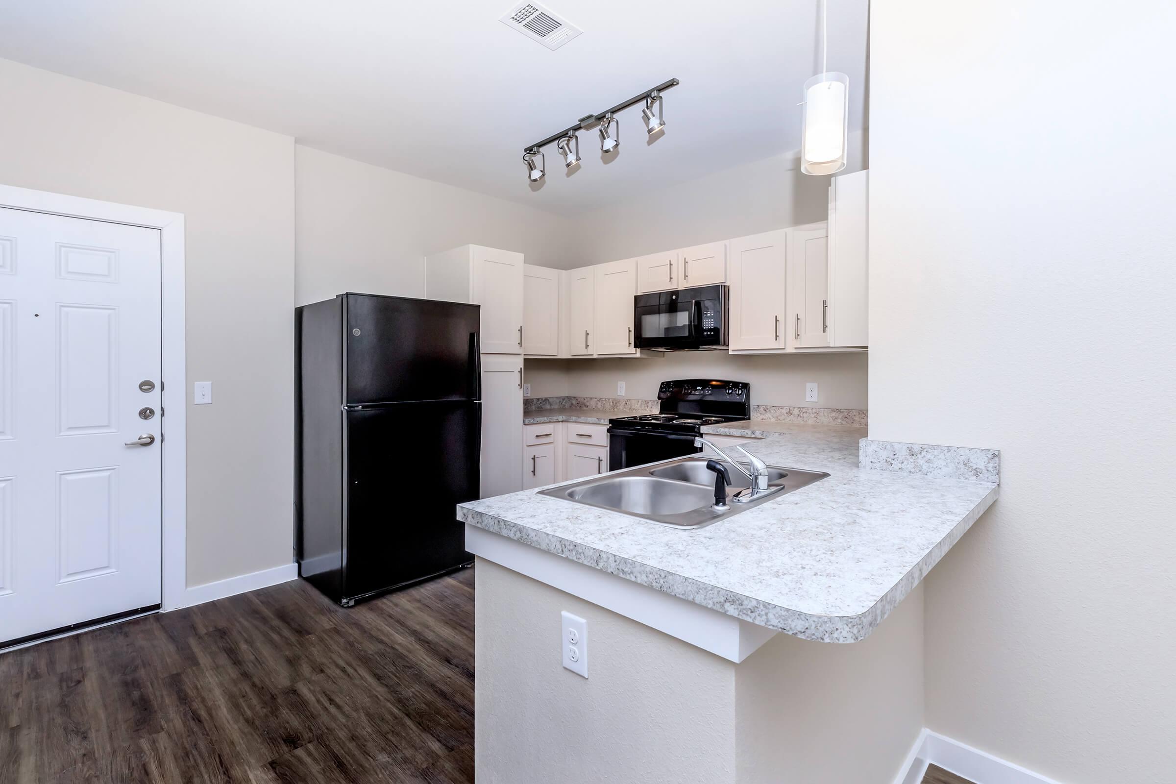 Apartments for Rent in Leander TX - Hills at Leander Spacious Kitchen with Plenty of Counterspace, Fully Equipped with Black Appliances, and Much More