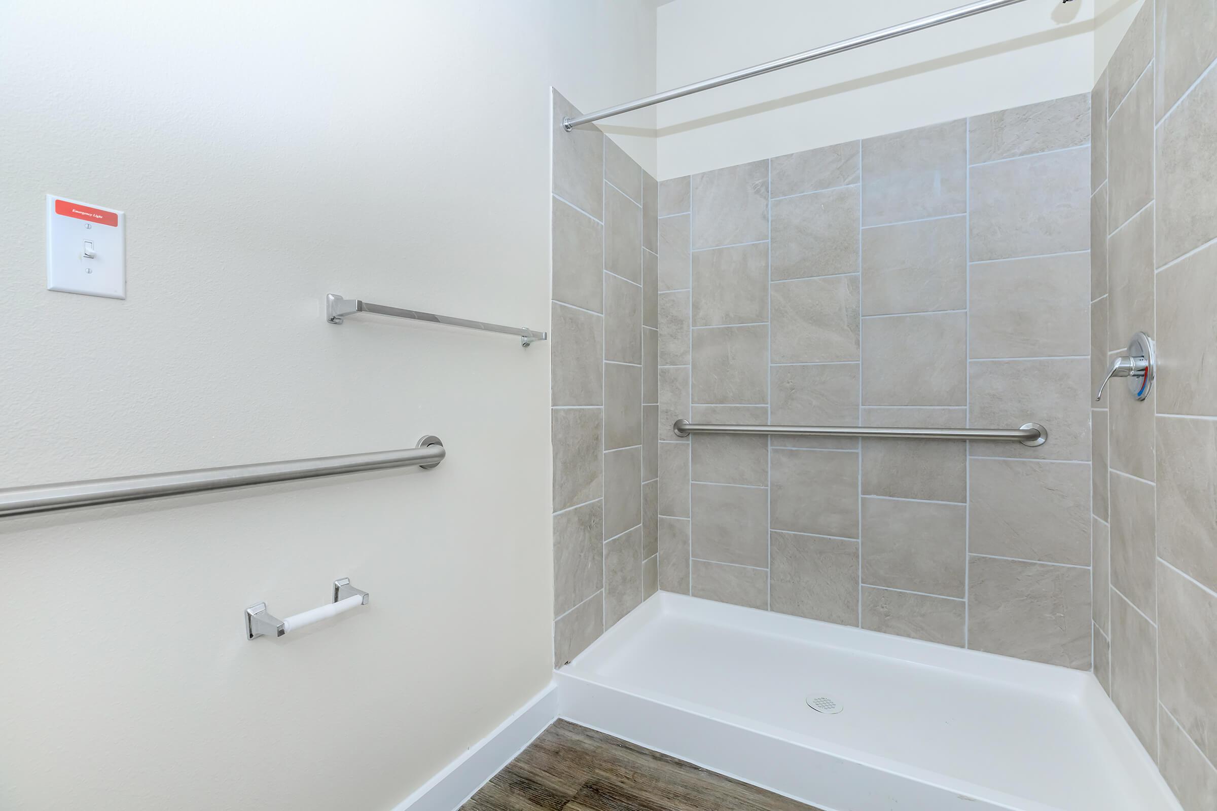 Apartments in Leander TX - Hills at Leander Expansive Bathroom with a Large Vanity, Shower, and Much More