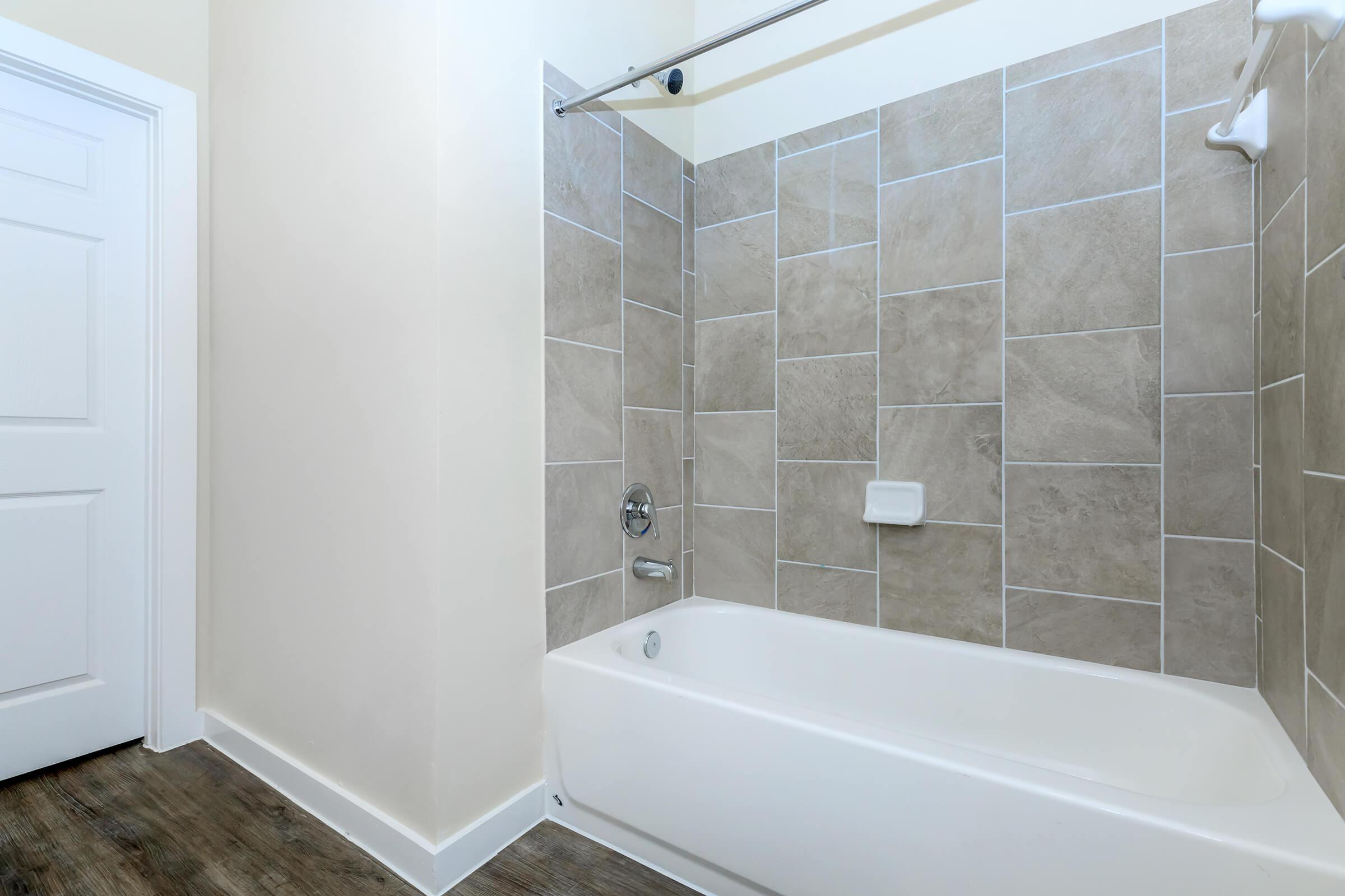 Apartments in Leander TX - Hills at Leander Expansive Bathroom with a Large Vanity, Shower, and Much More