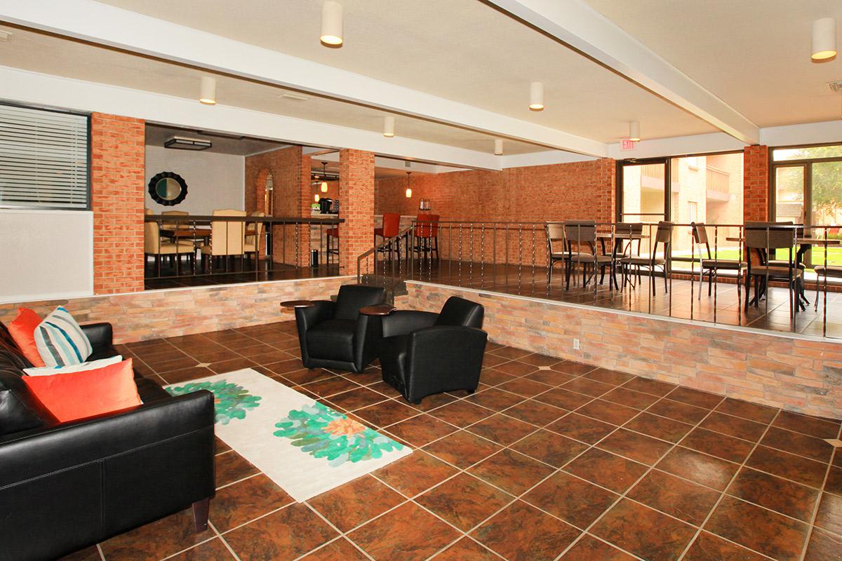 a living room filled with furniture and a large window