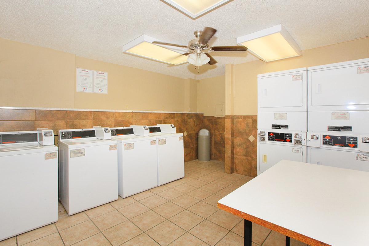 a kitchen with a sink and a refrigerator