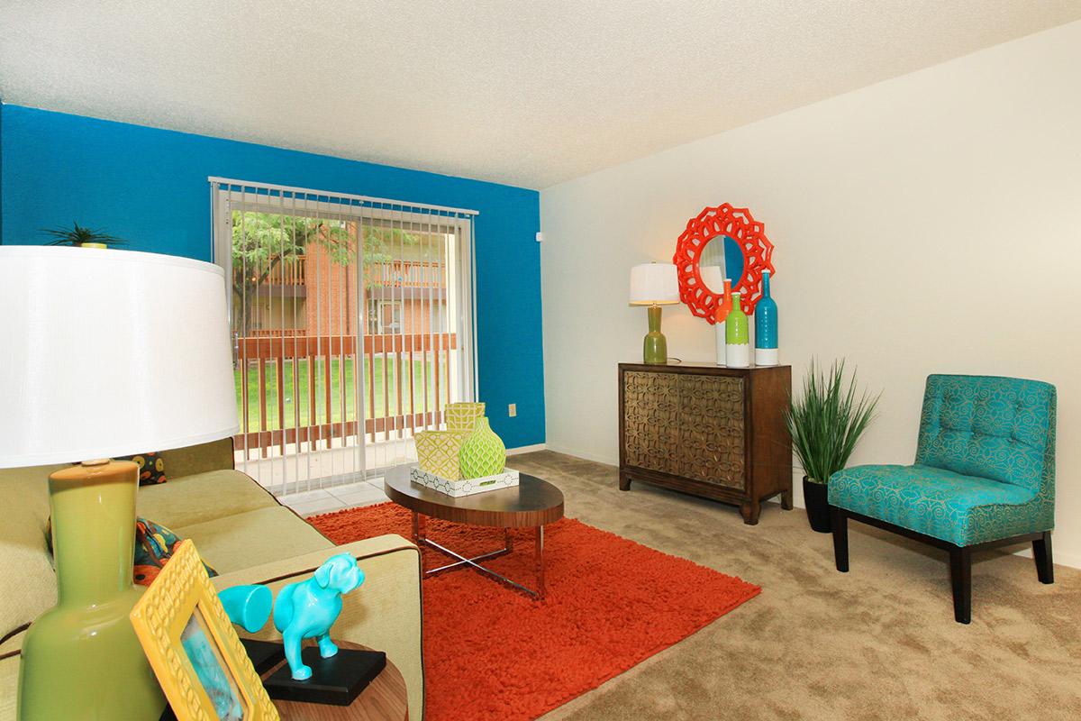 a living room filled with furniture and a rug