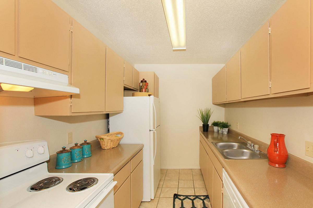 a kitchen with a sink and a microwave