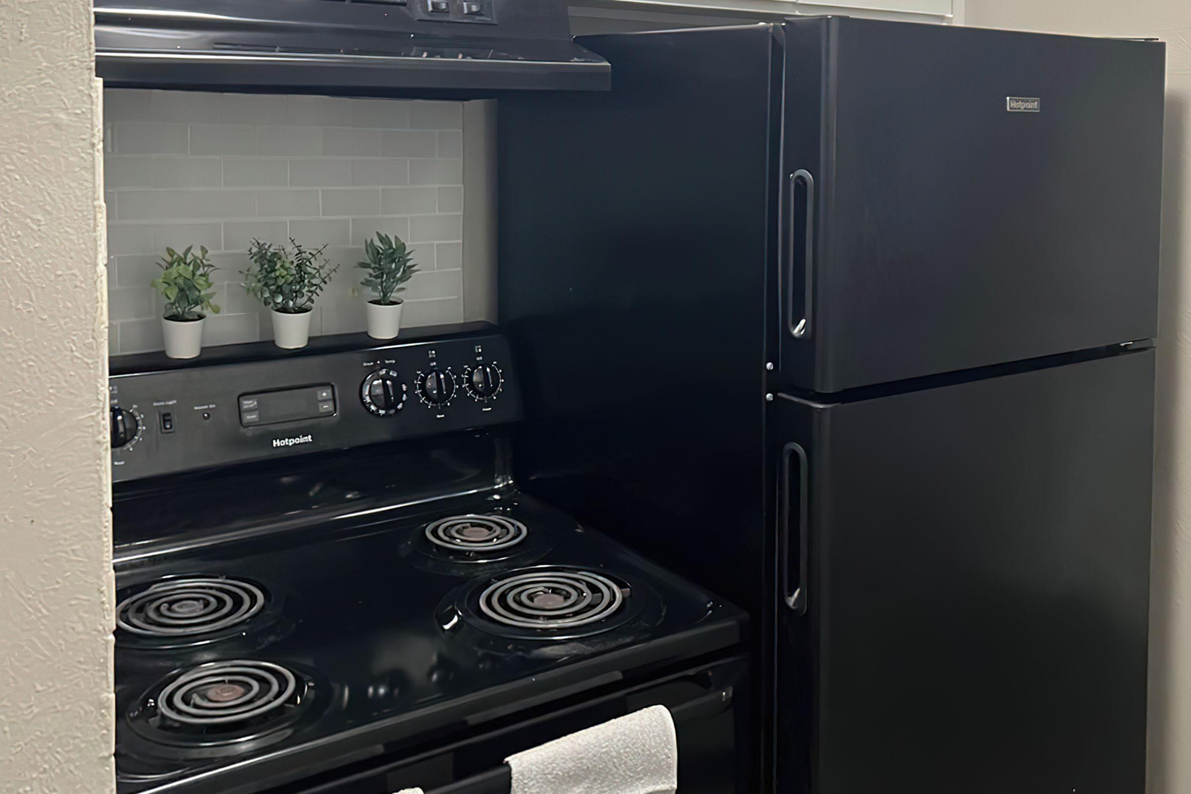 a stove top oven sitting inside of a refrigerator