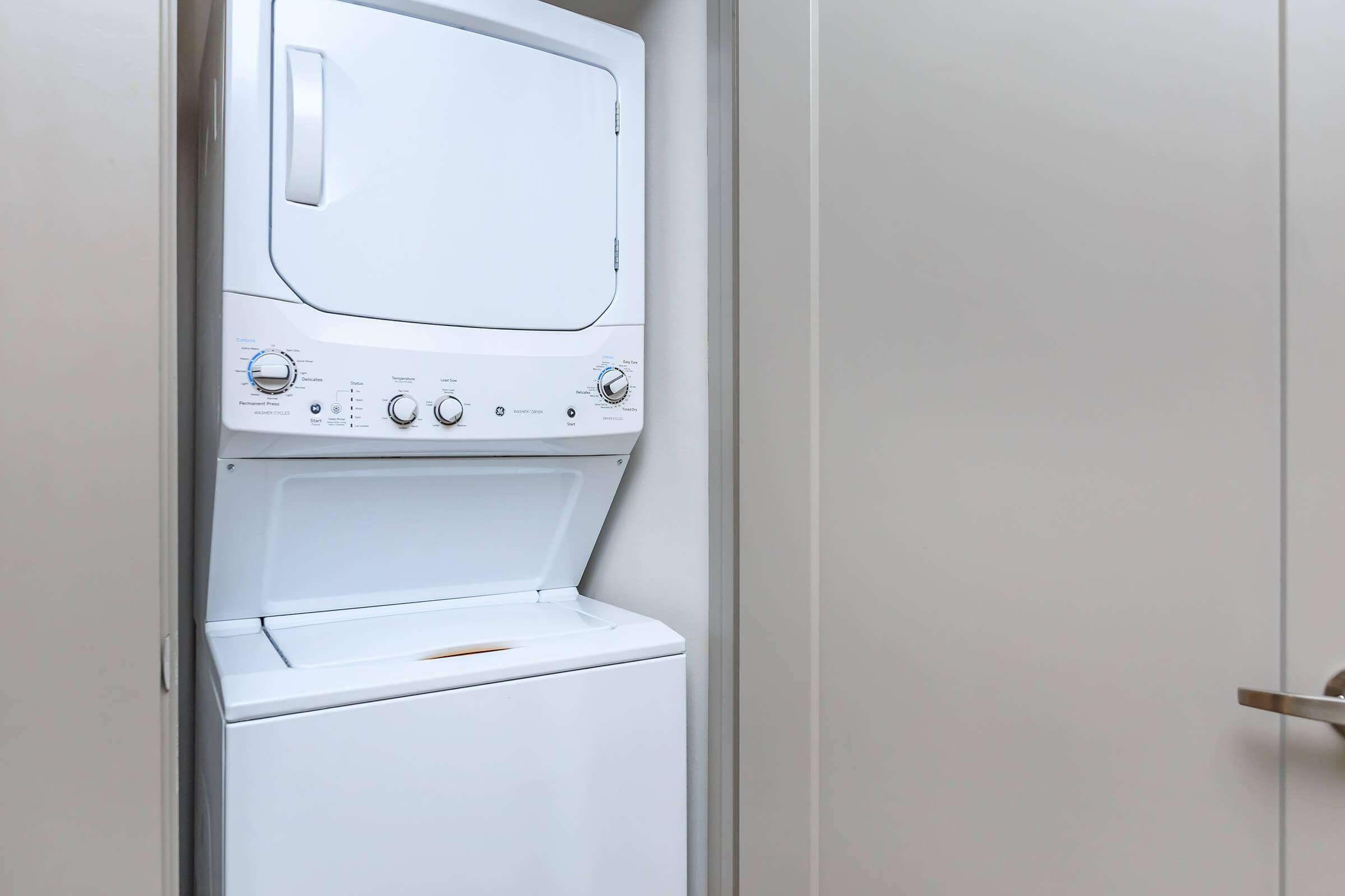 a white refrigerator freezer sitting inside of a kitchen