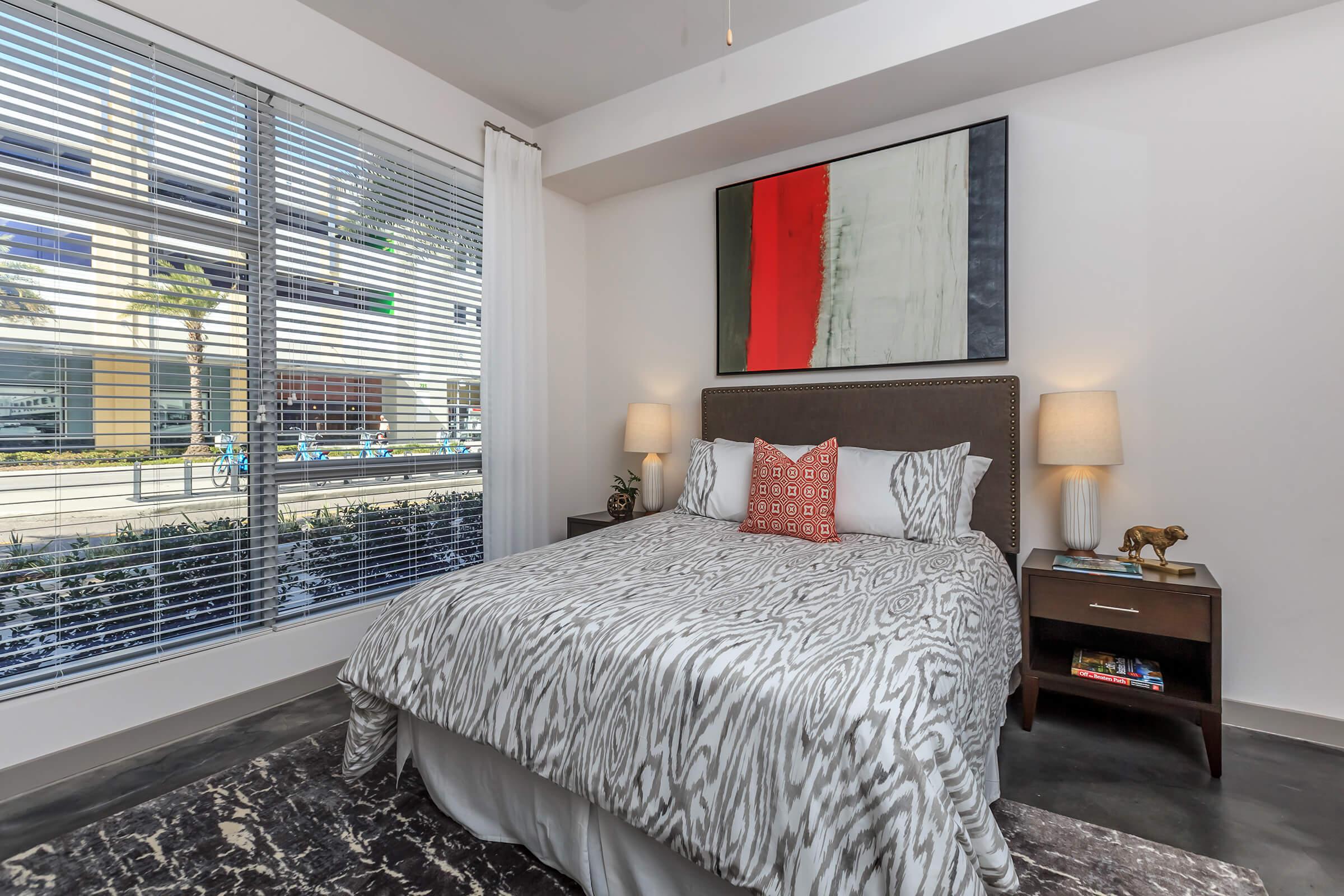 a bedroom with a large bed in a room