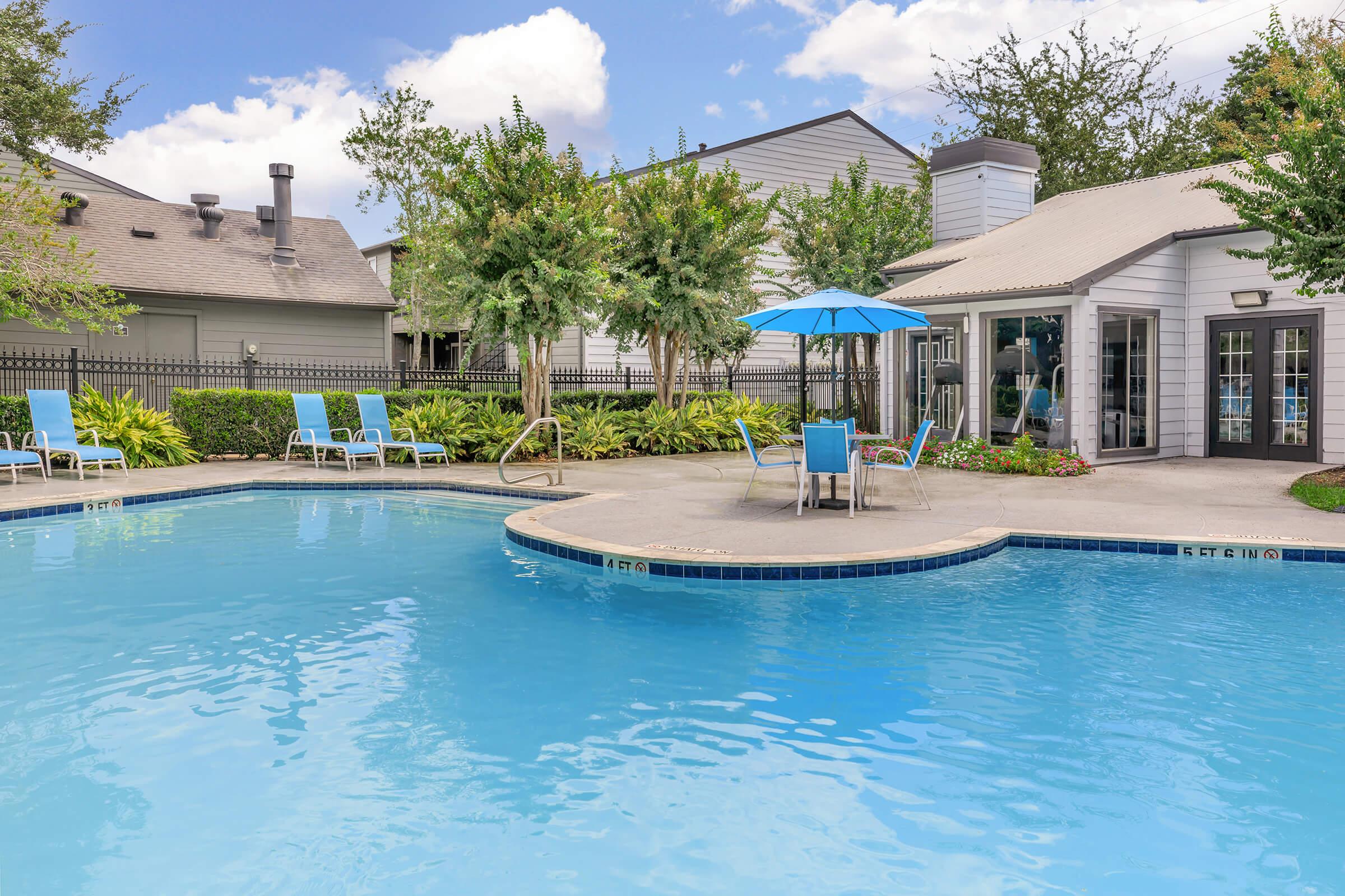 a large pool of water in front of a house