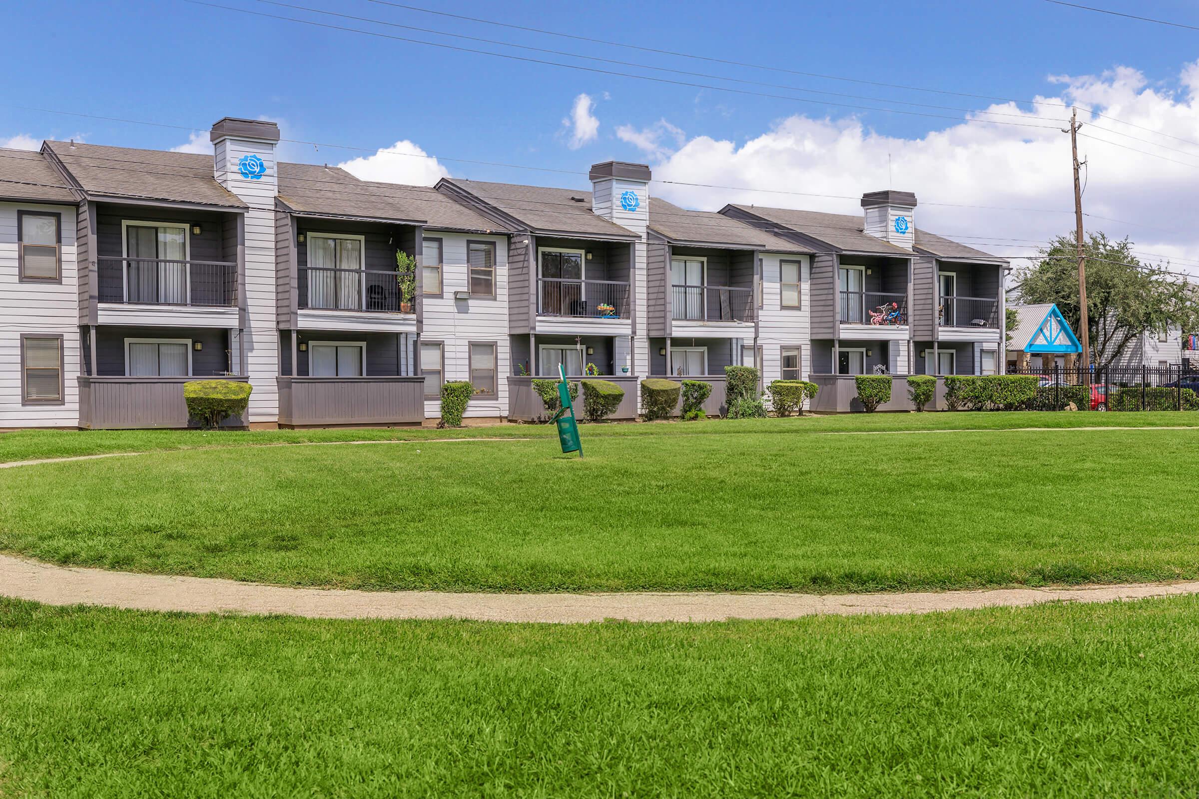 a large lawn in front of a building