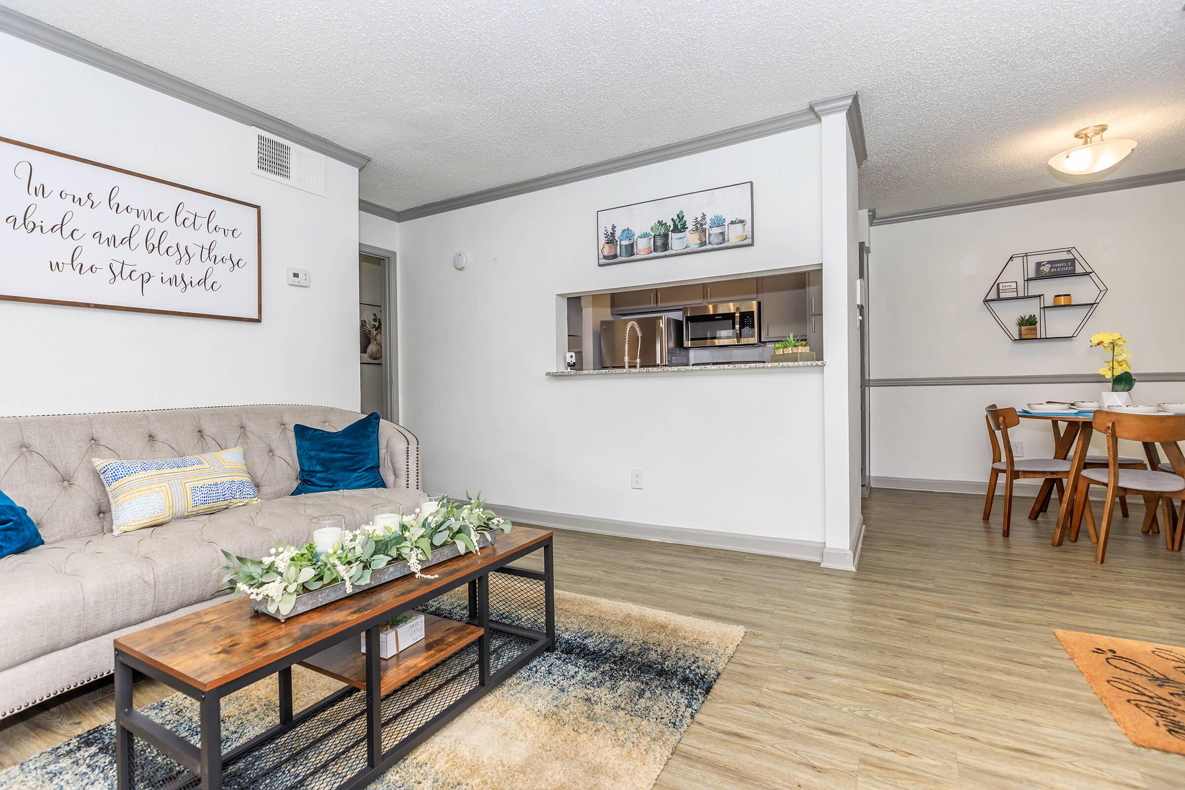 a living room filled with furniture and a table