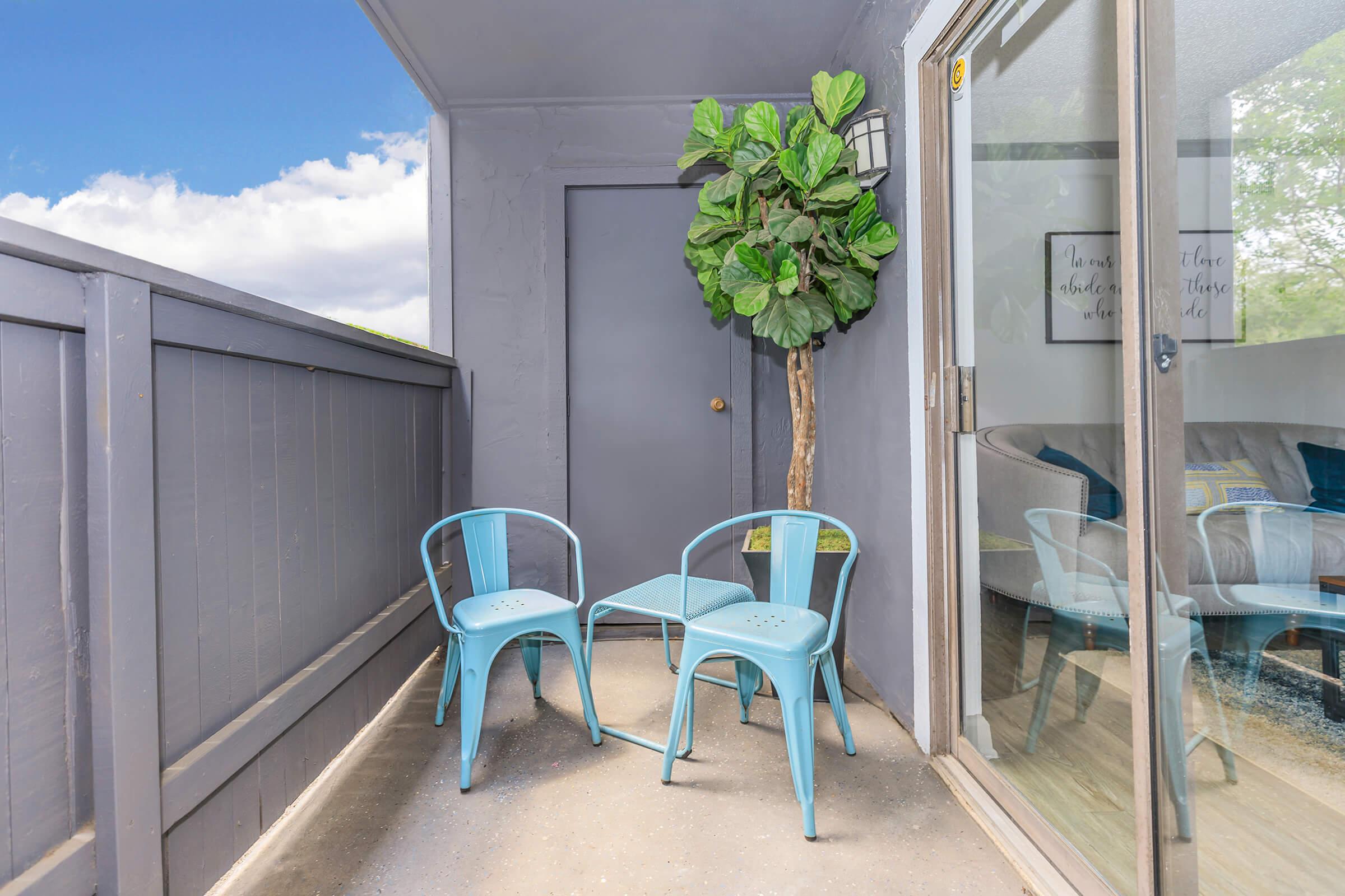 a chair sitting in front of a building