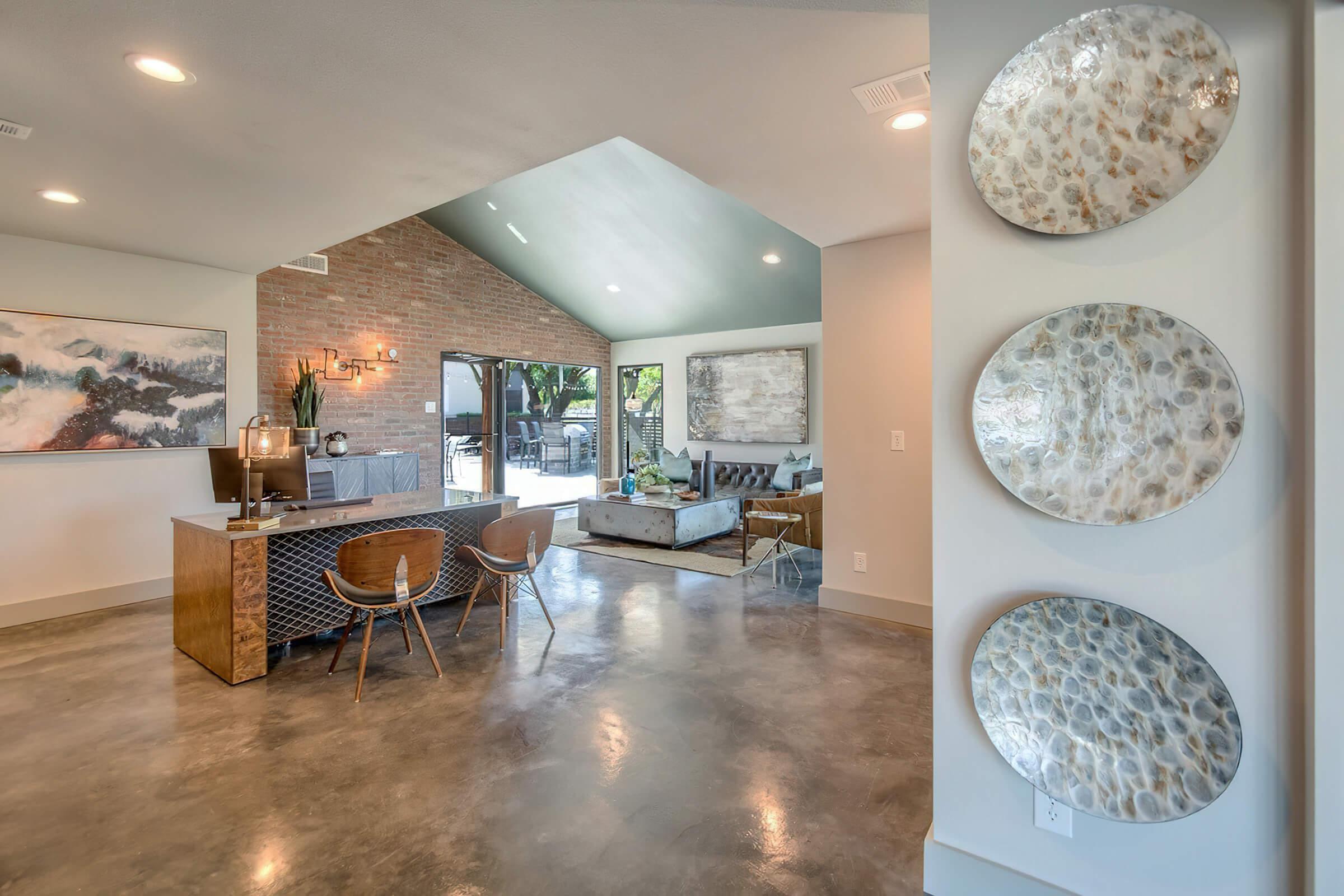 a living room filled with furniture and a table