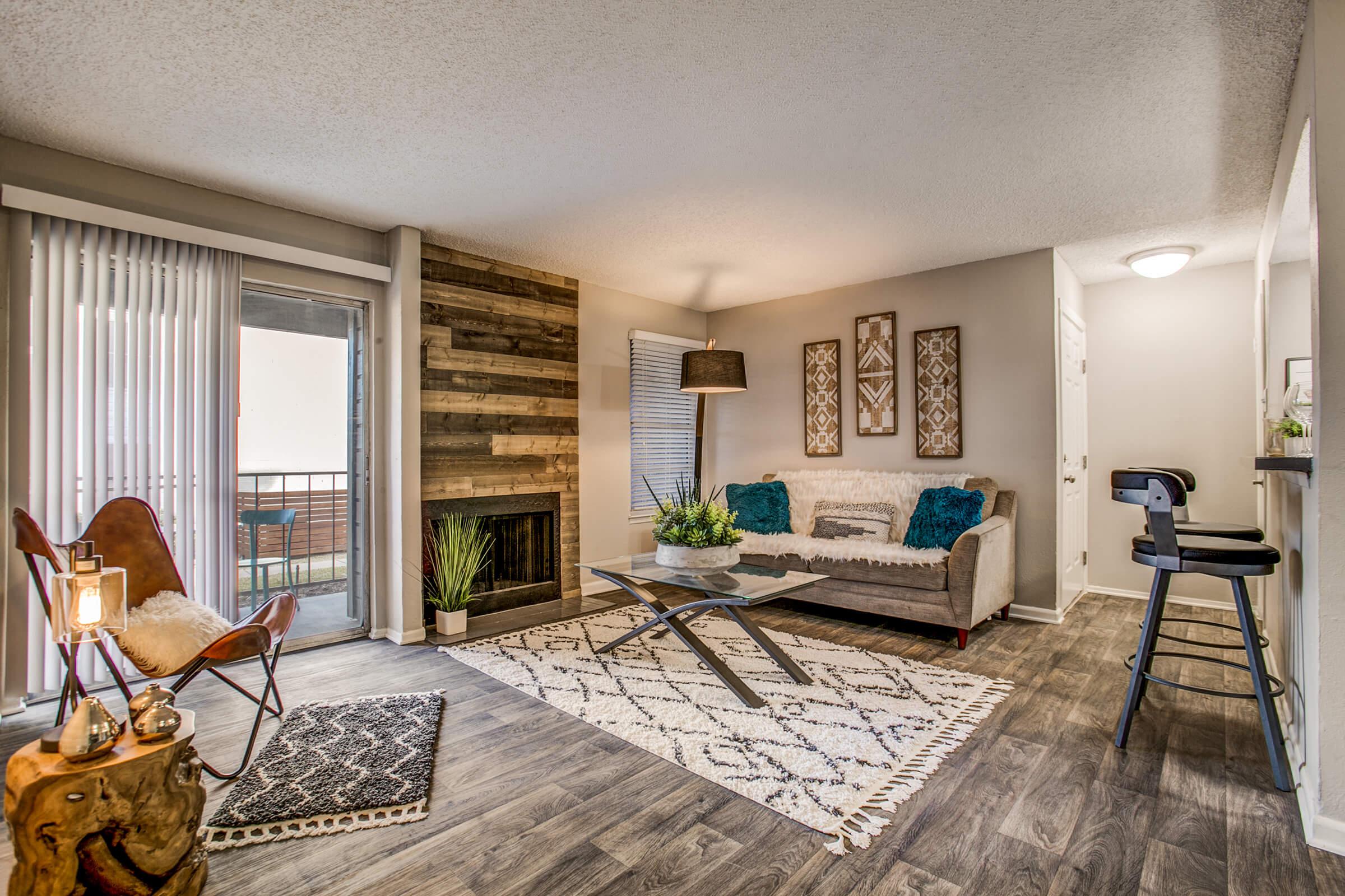 a living room filled with furniture and a large window