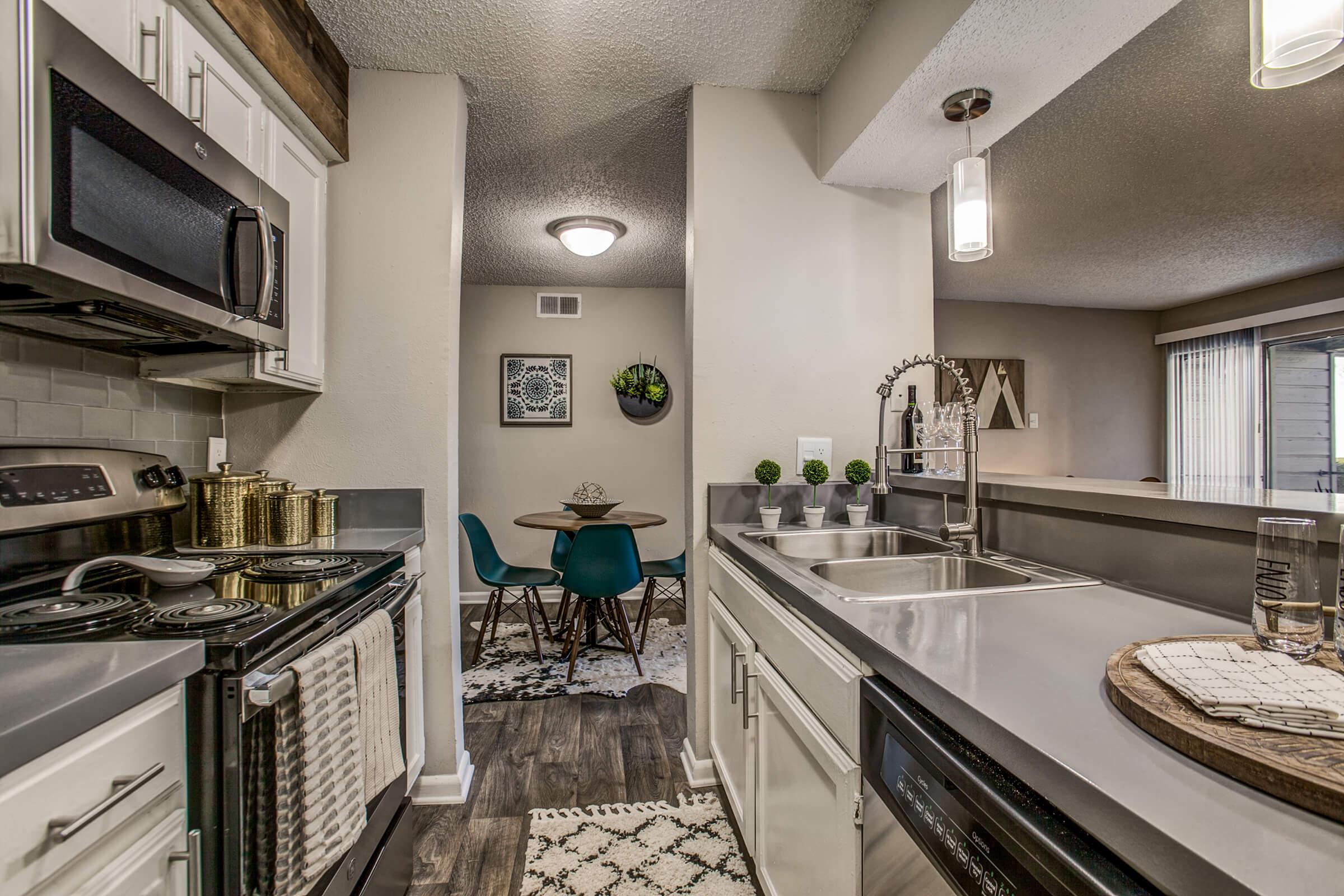 a kitchen with a sink and a window