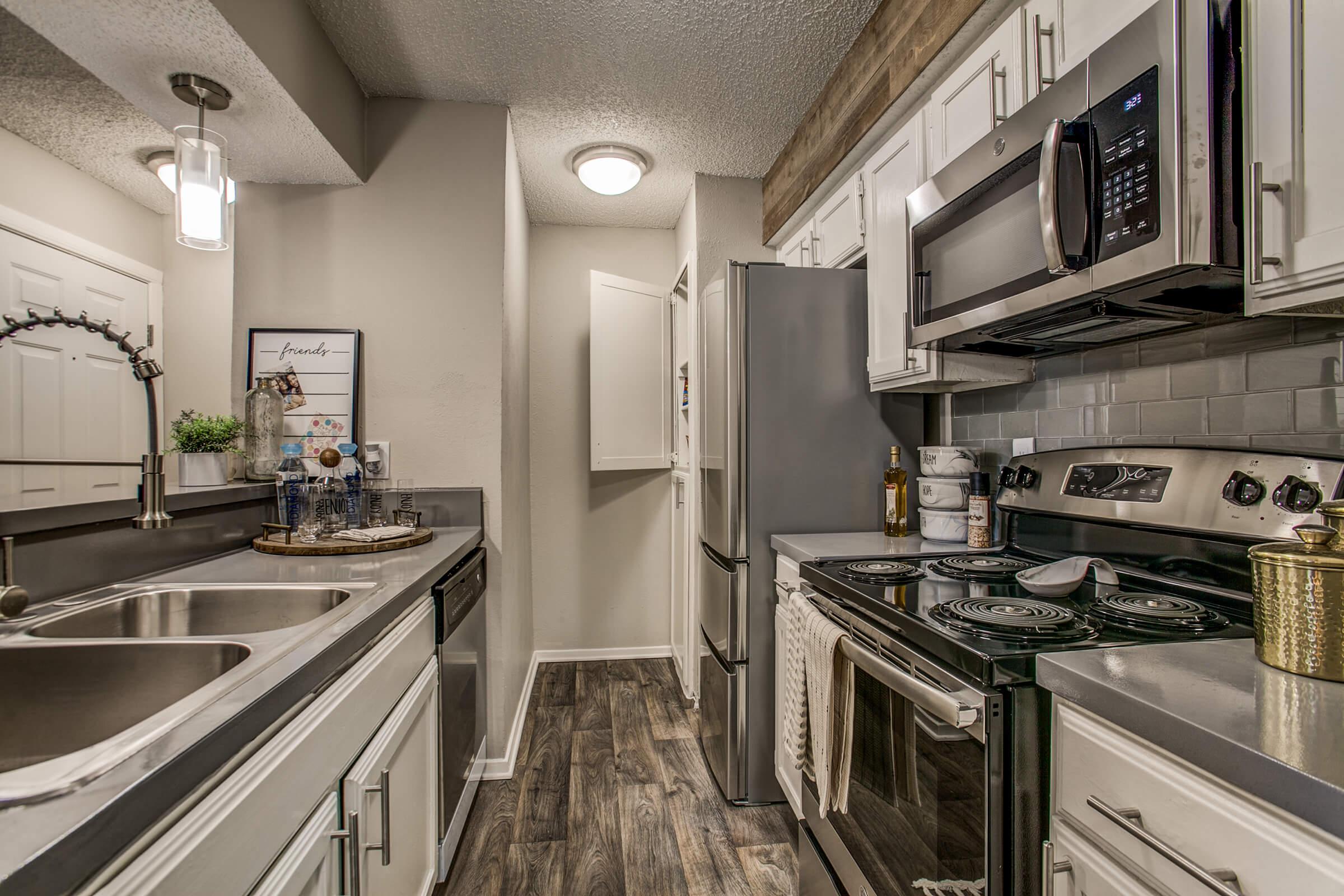 a large kitchen with stainless steel appliances