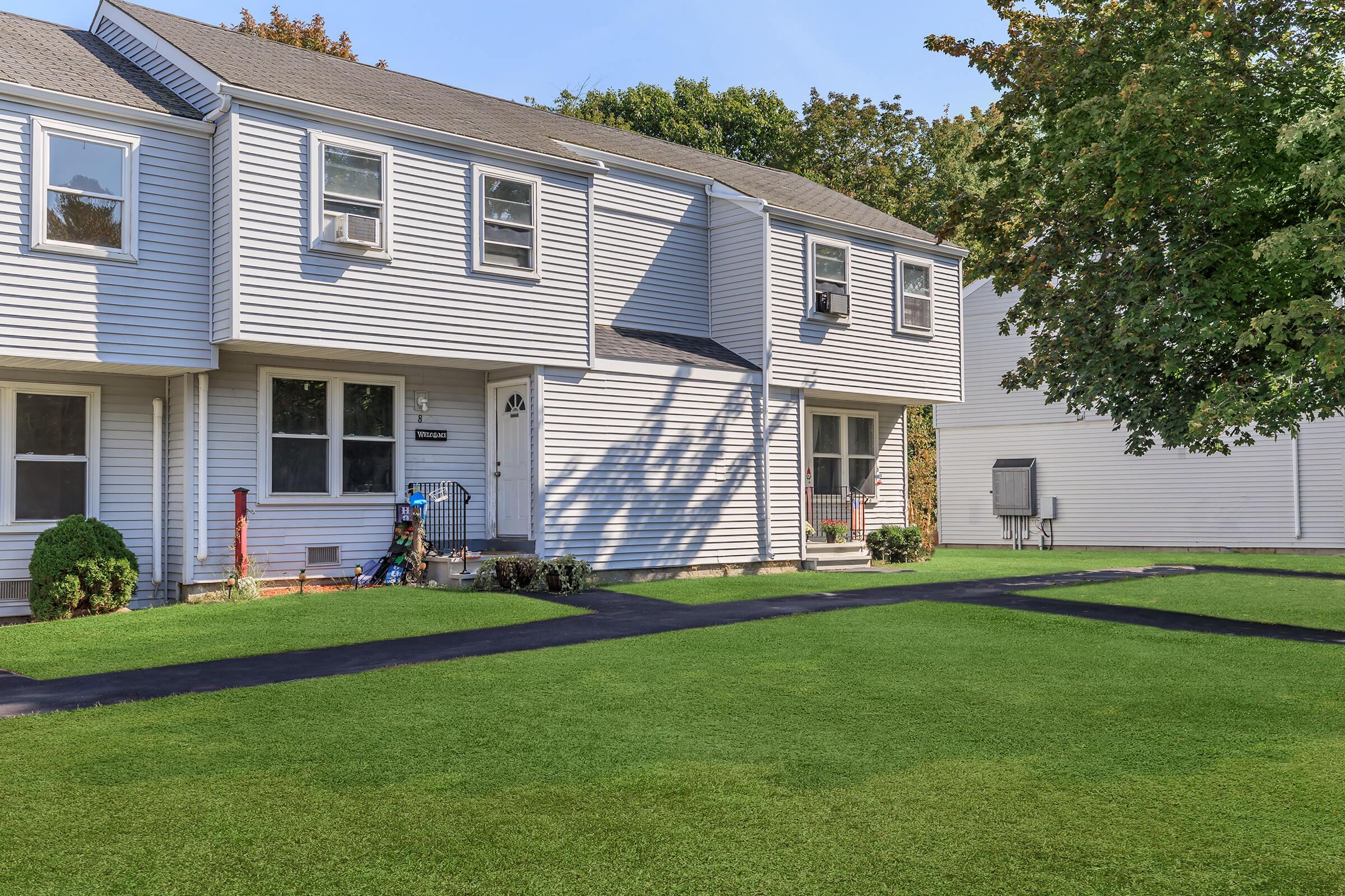 a large lawn in front of a house