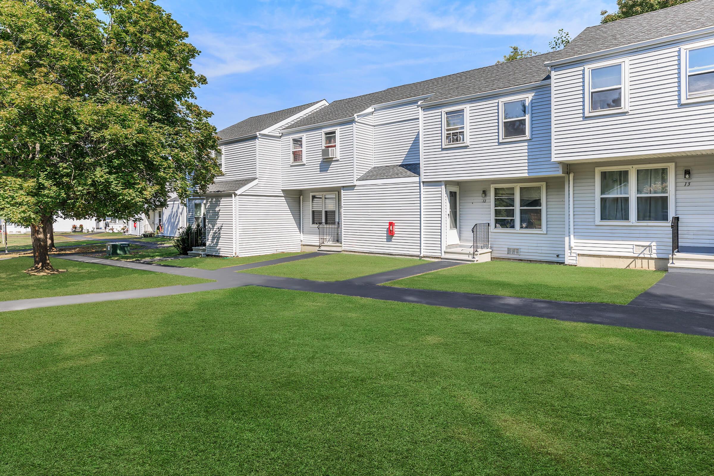 a large lawn in front of a house