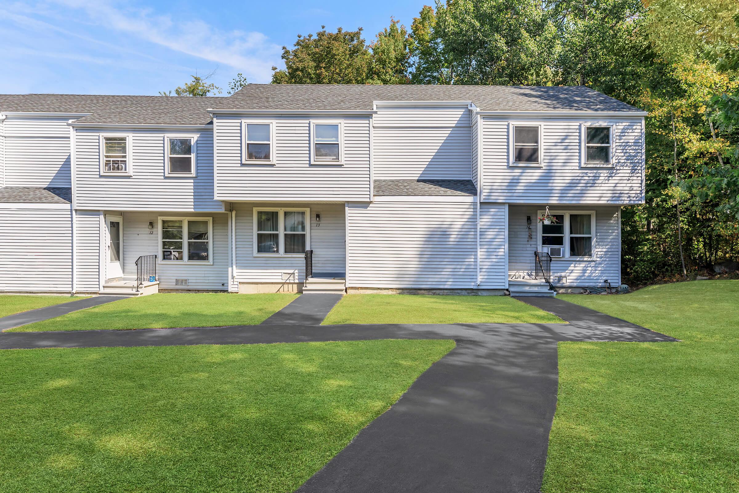 a large lawn in front of a house