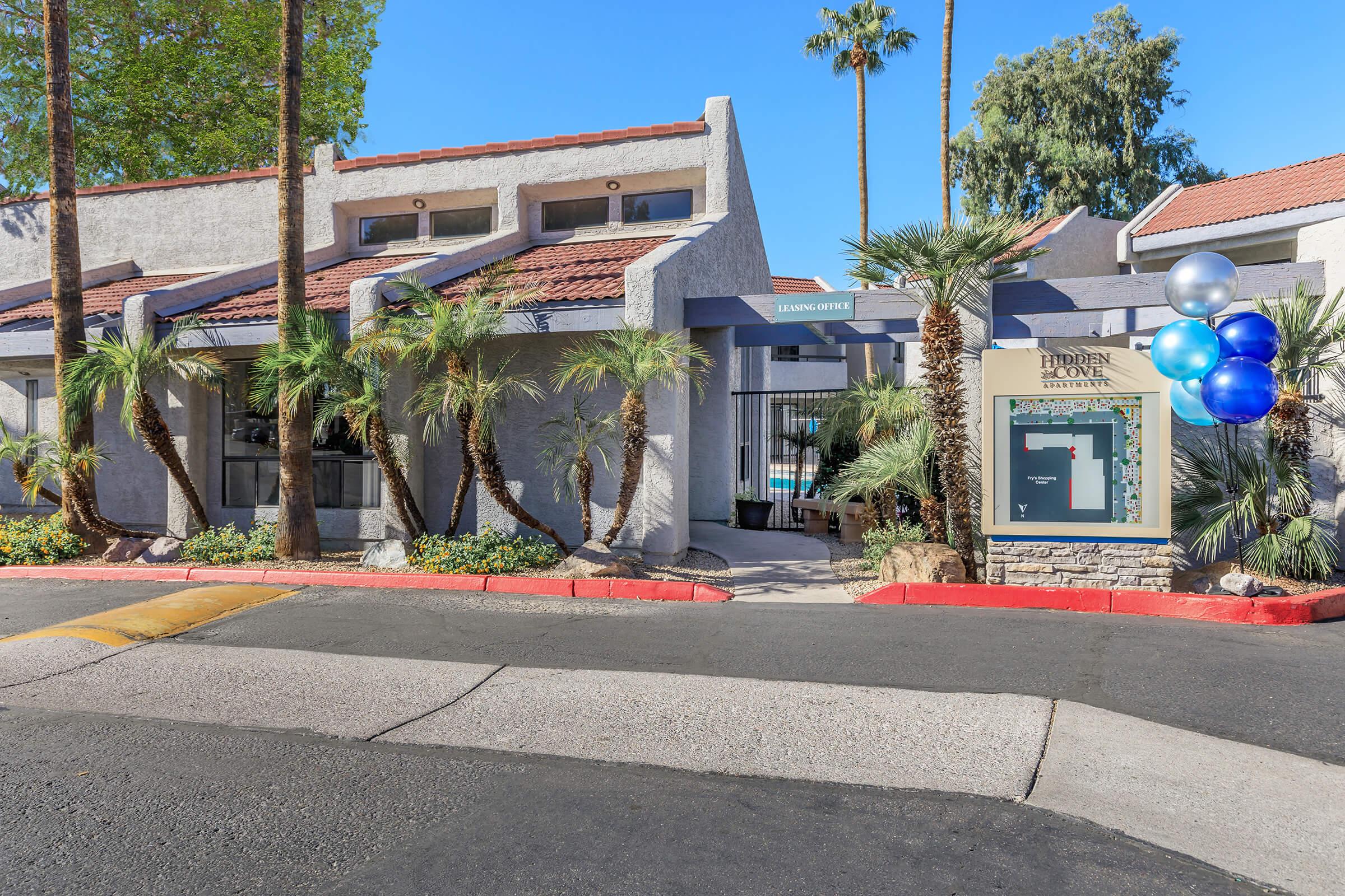 a building with a store on the side of a road