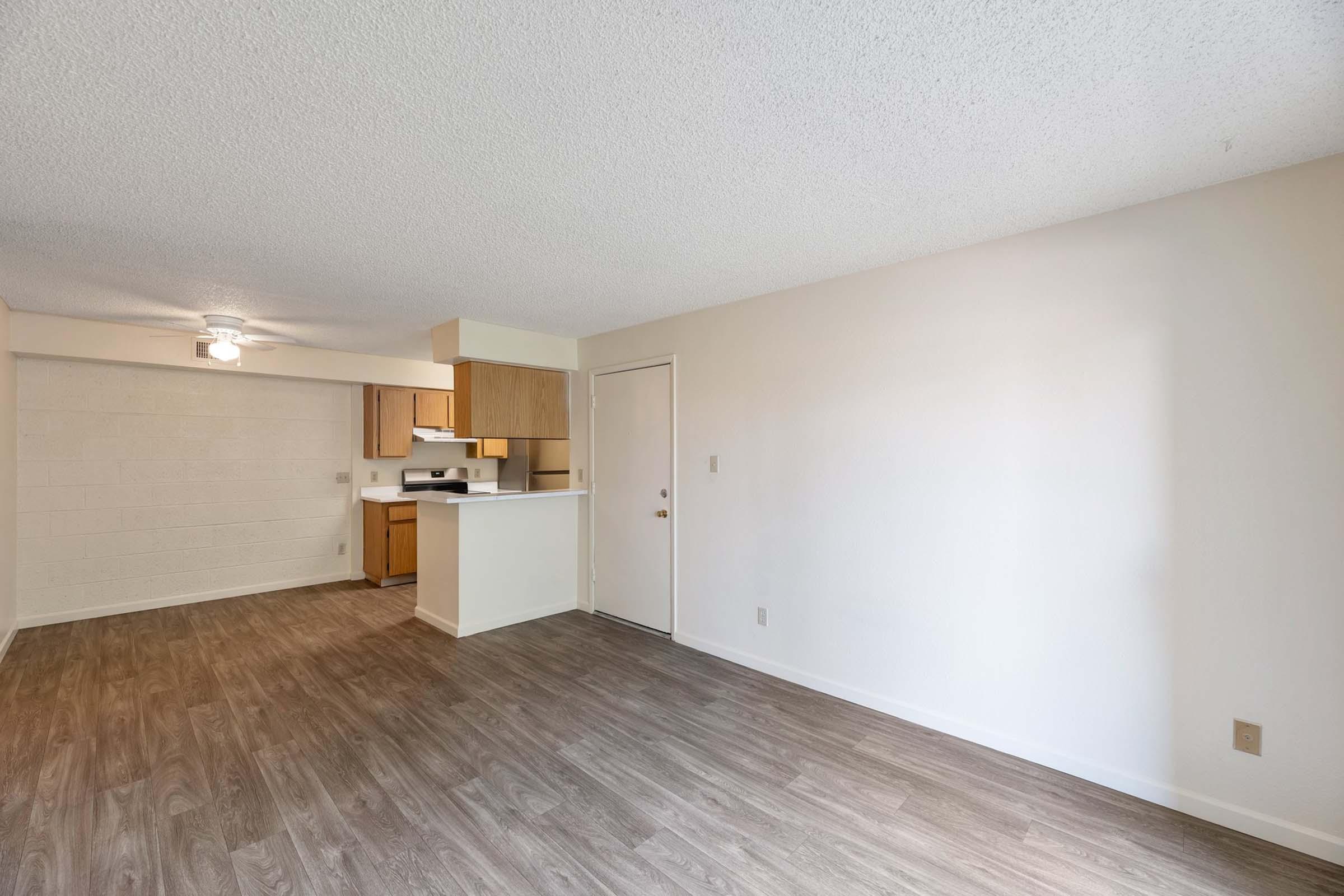 a bedroom with a wood floor