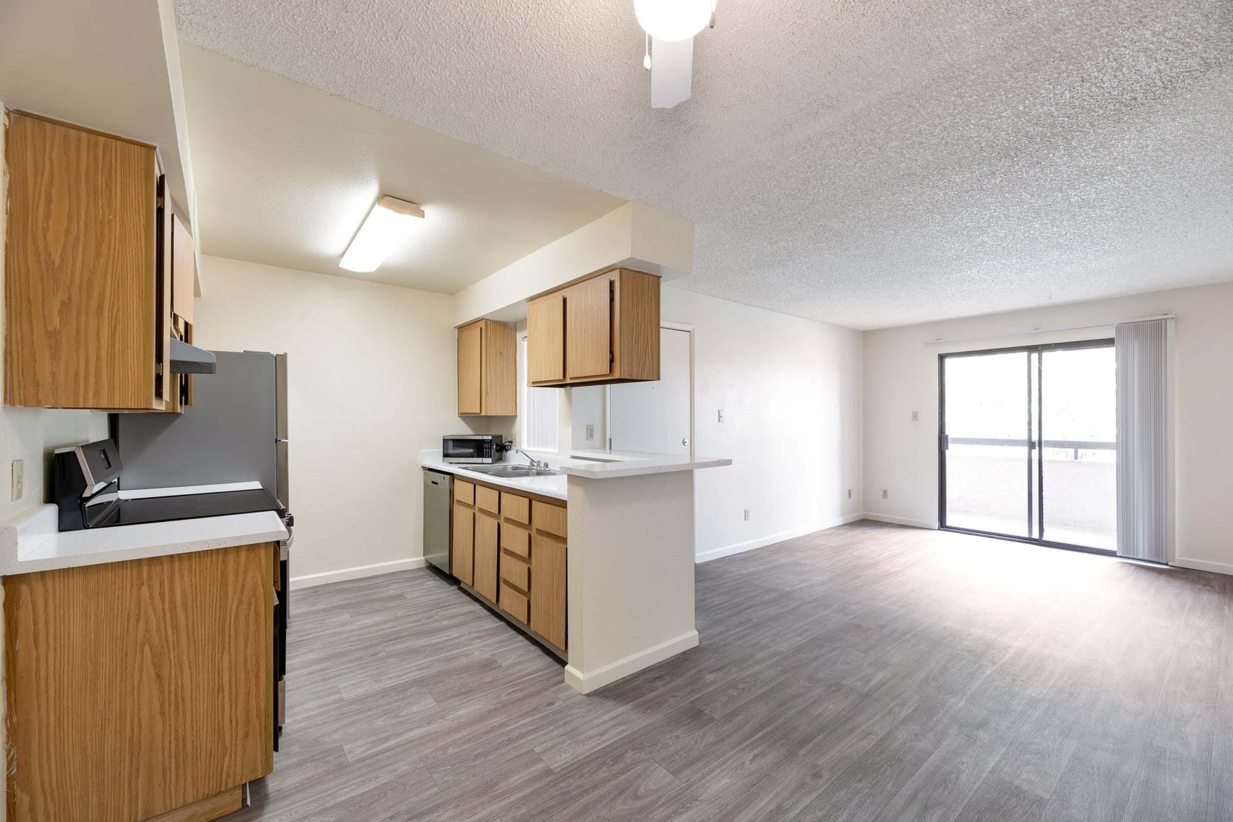 a kitchen with a wood floor