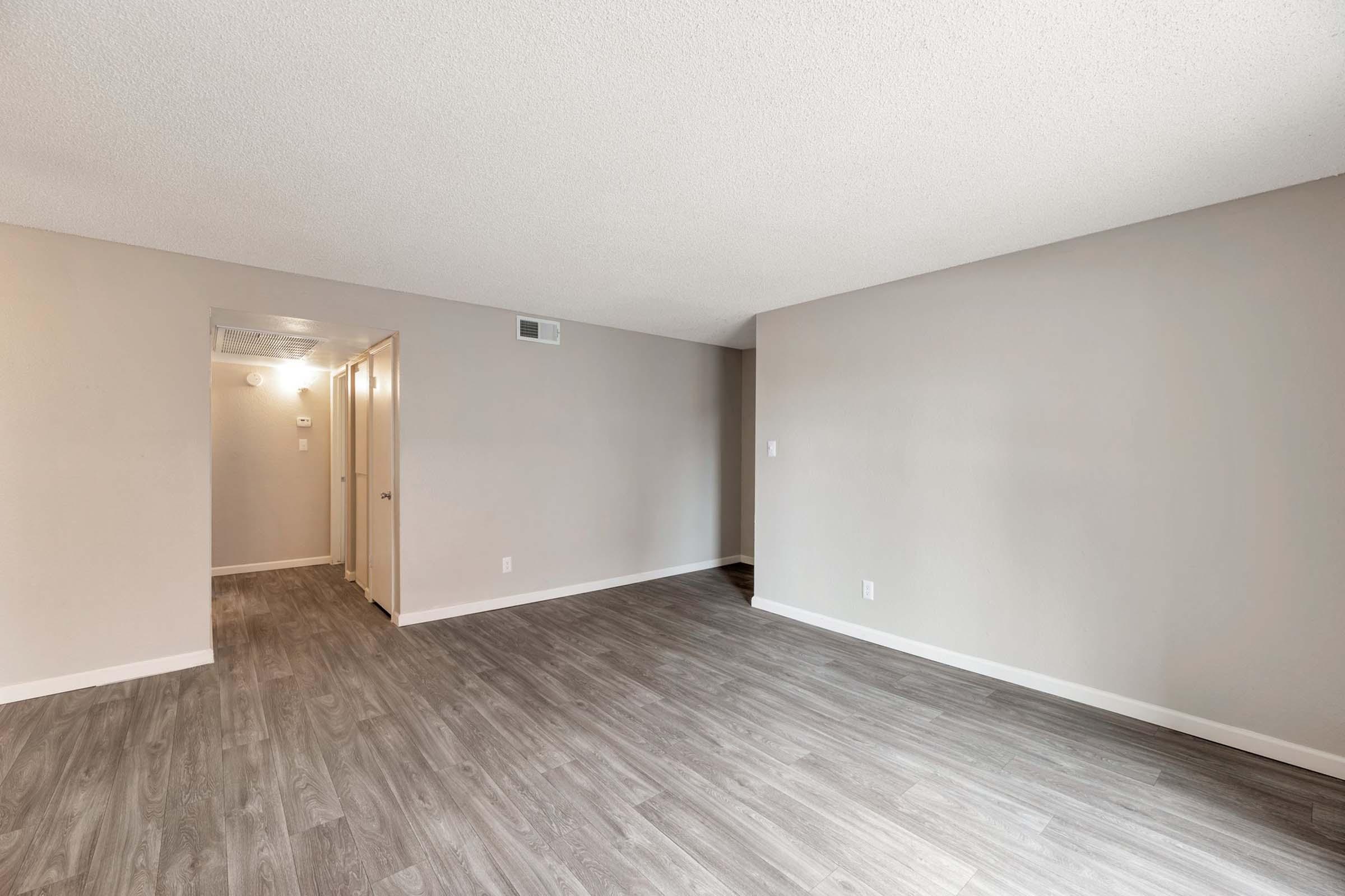 a kitchen with a wood floor