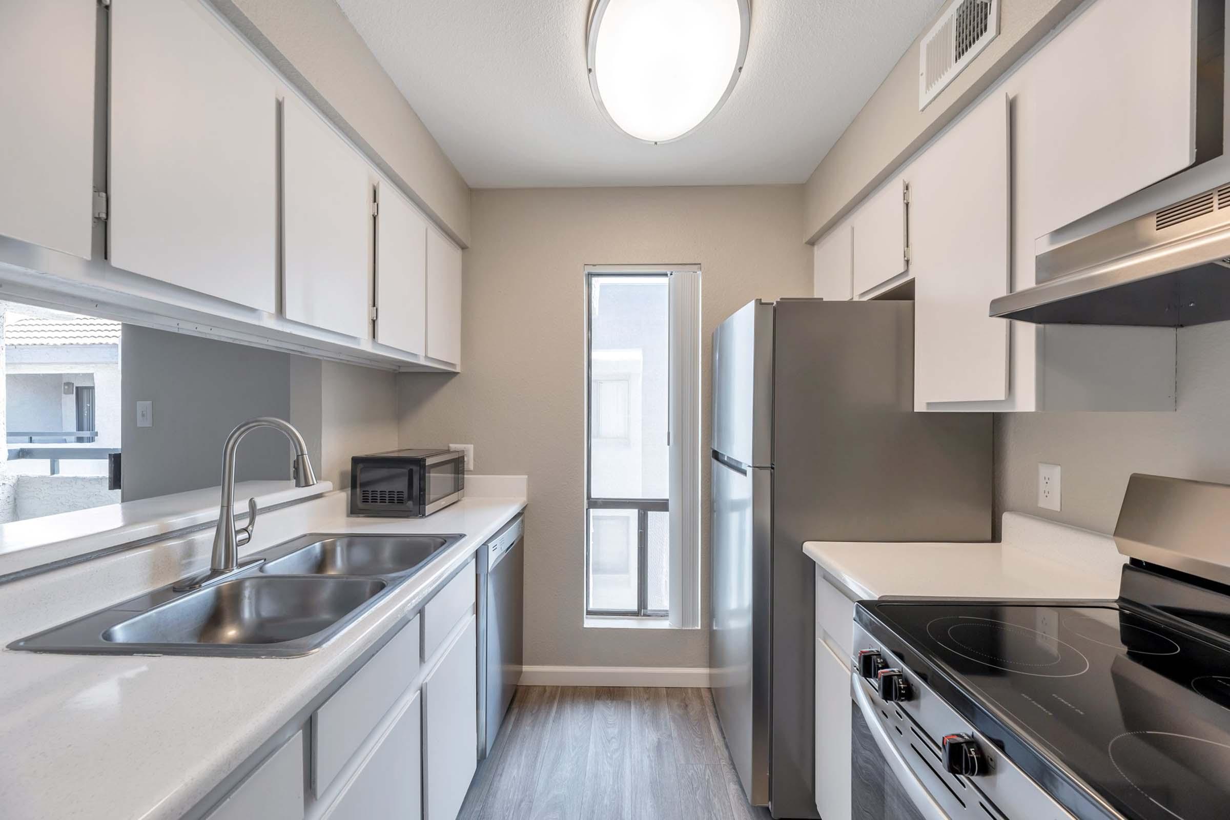 a kitchen with a stove and a sink