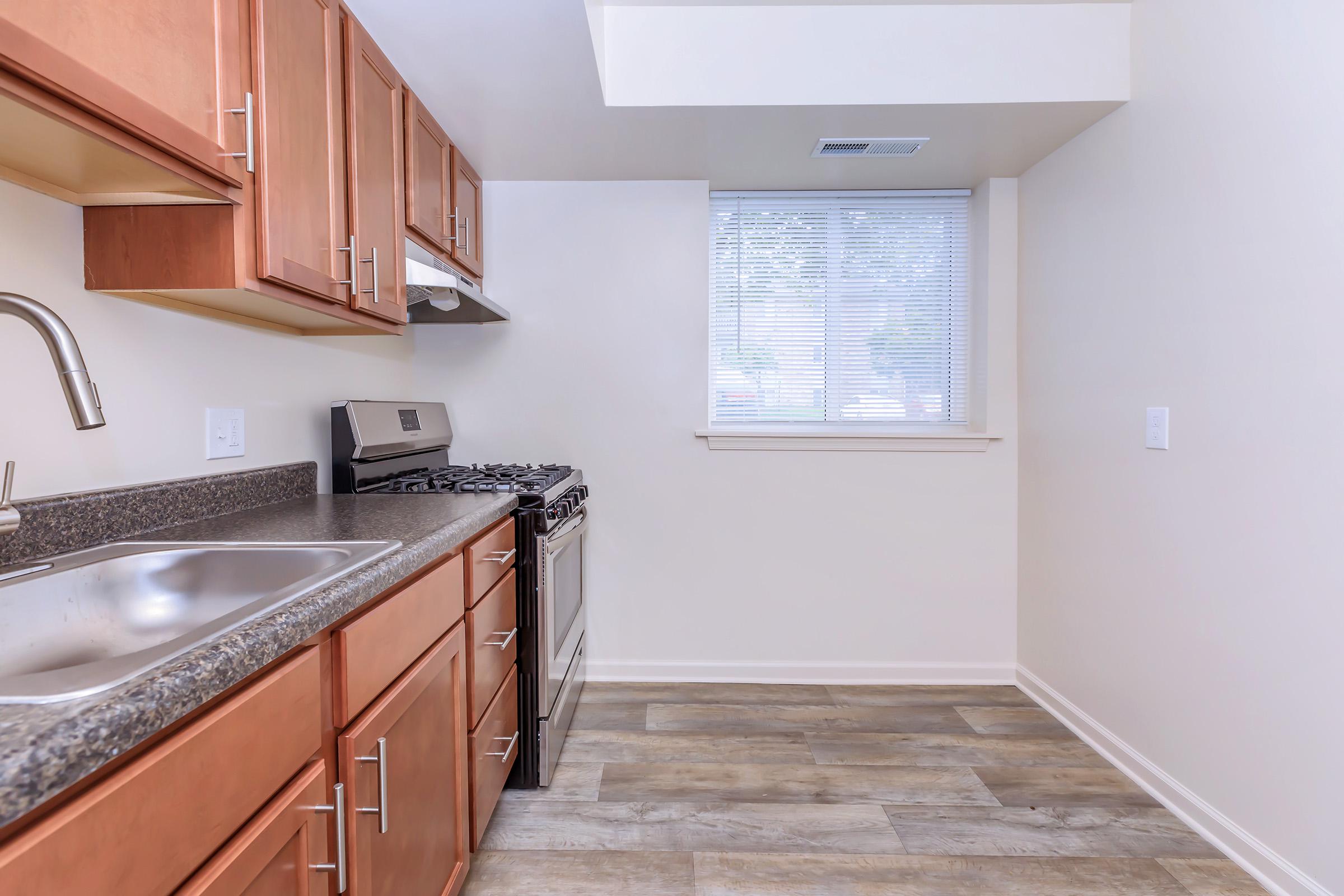 a kitchen with a sink and a microwave