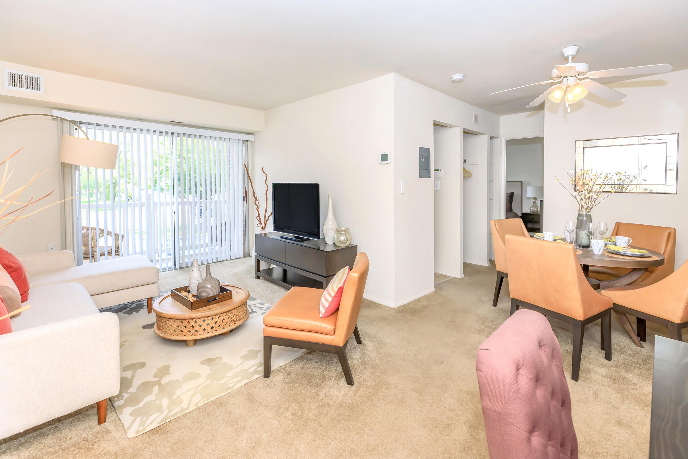 a living room filled with furniture and a rug