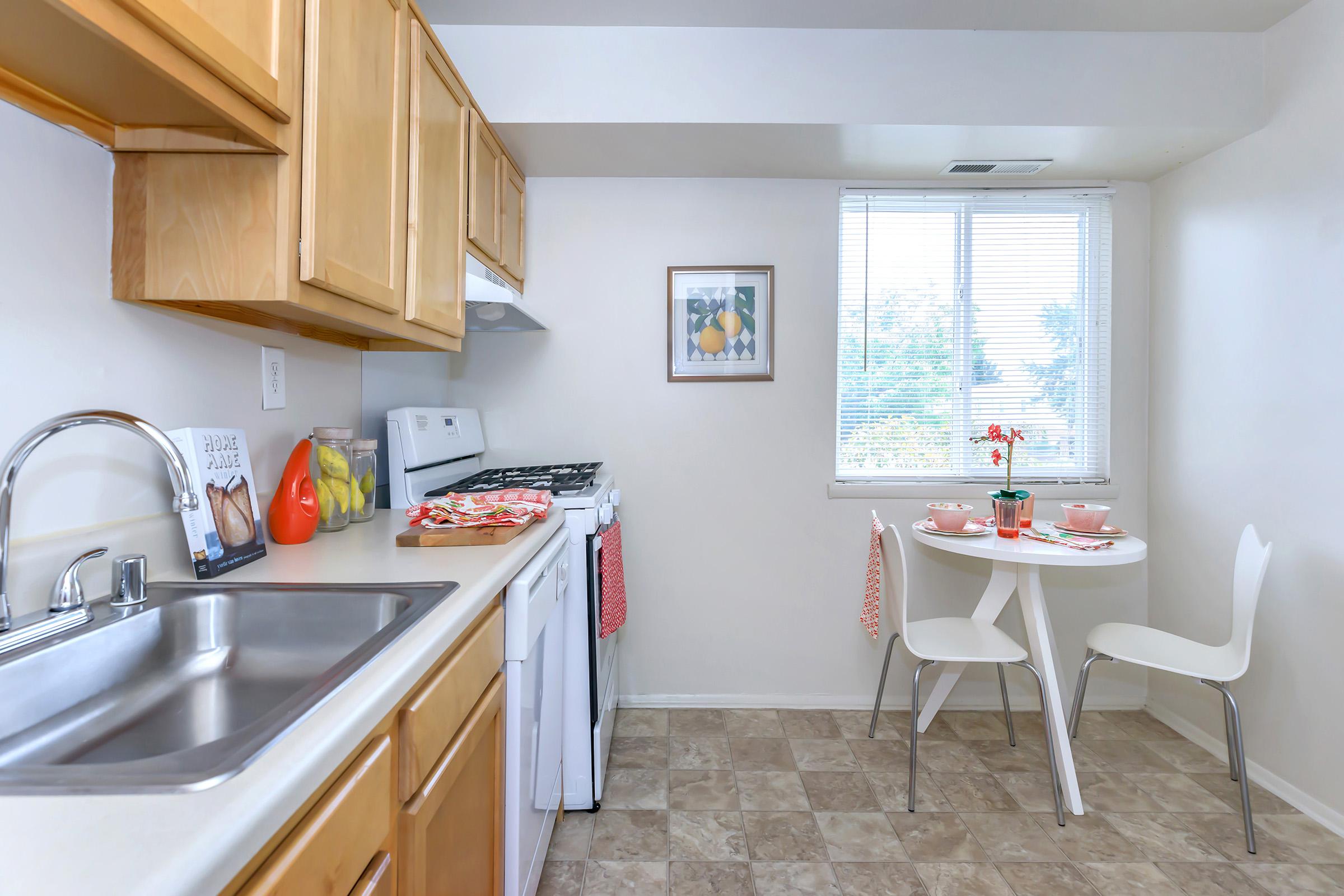 a kitchen with a sink and a microwave