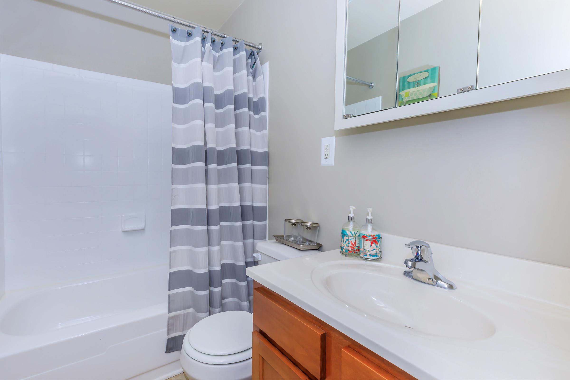 a room with a sink and a shower