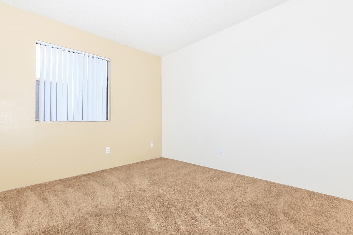 a bedroom with a bed in a room