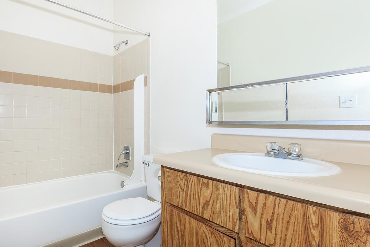 a large white tub sitting next to a sink