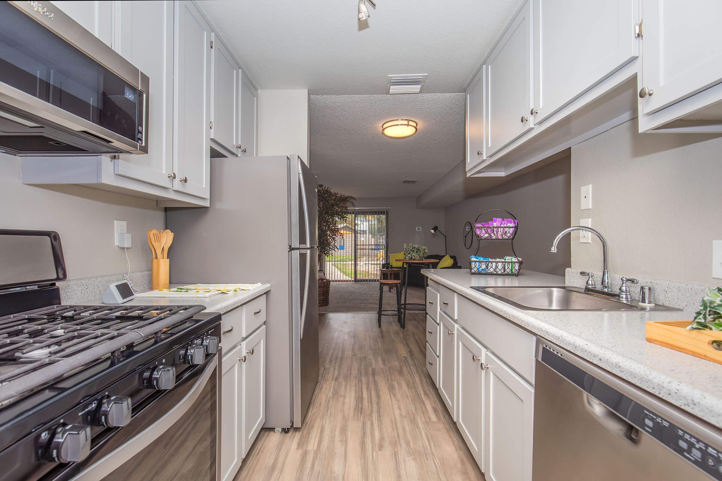 a large kitchen with stainless steel appliances