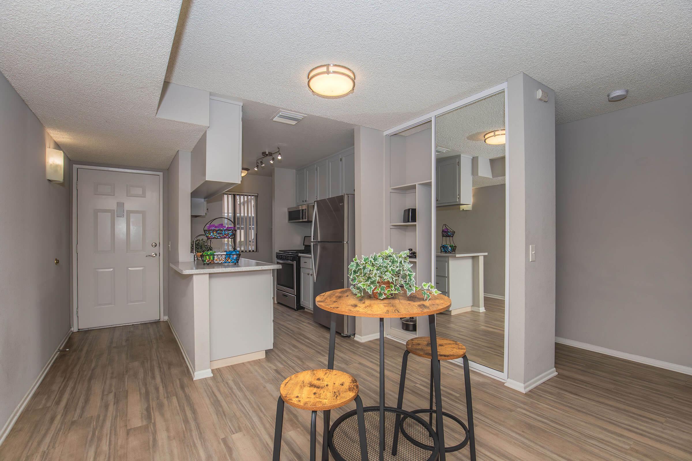 a kitchen filled with lots of furniture