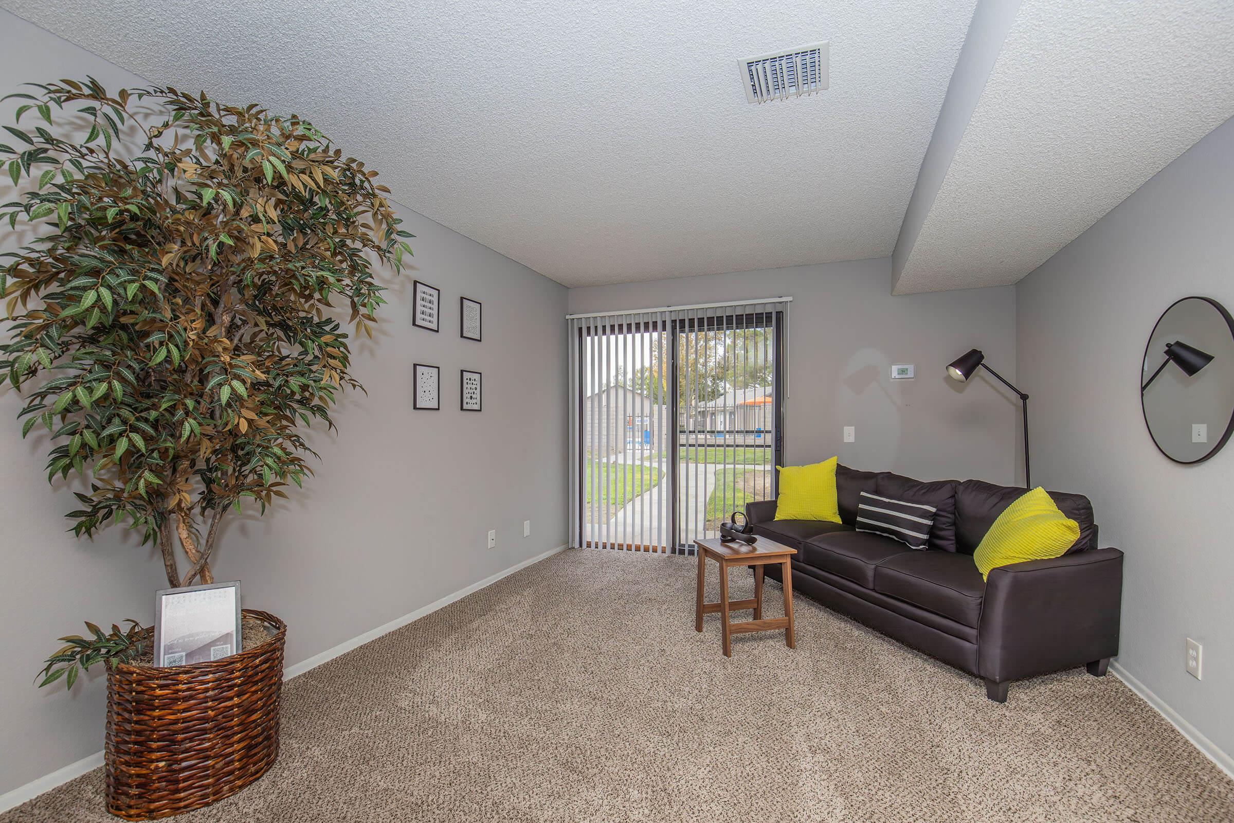 a living room filled with furniture and a flat screen tv