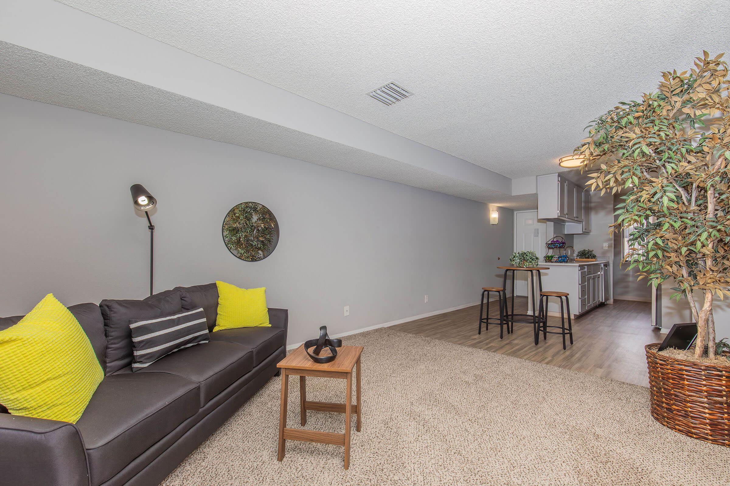 a living room filled with furniture and a table