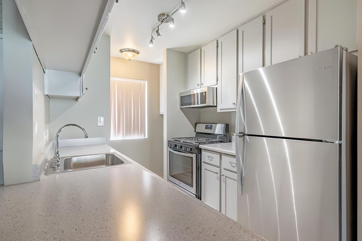 a stainless steel refrigerator in a kitchen