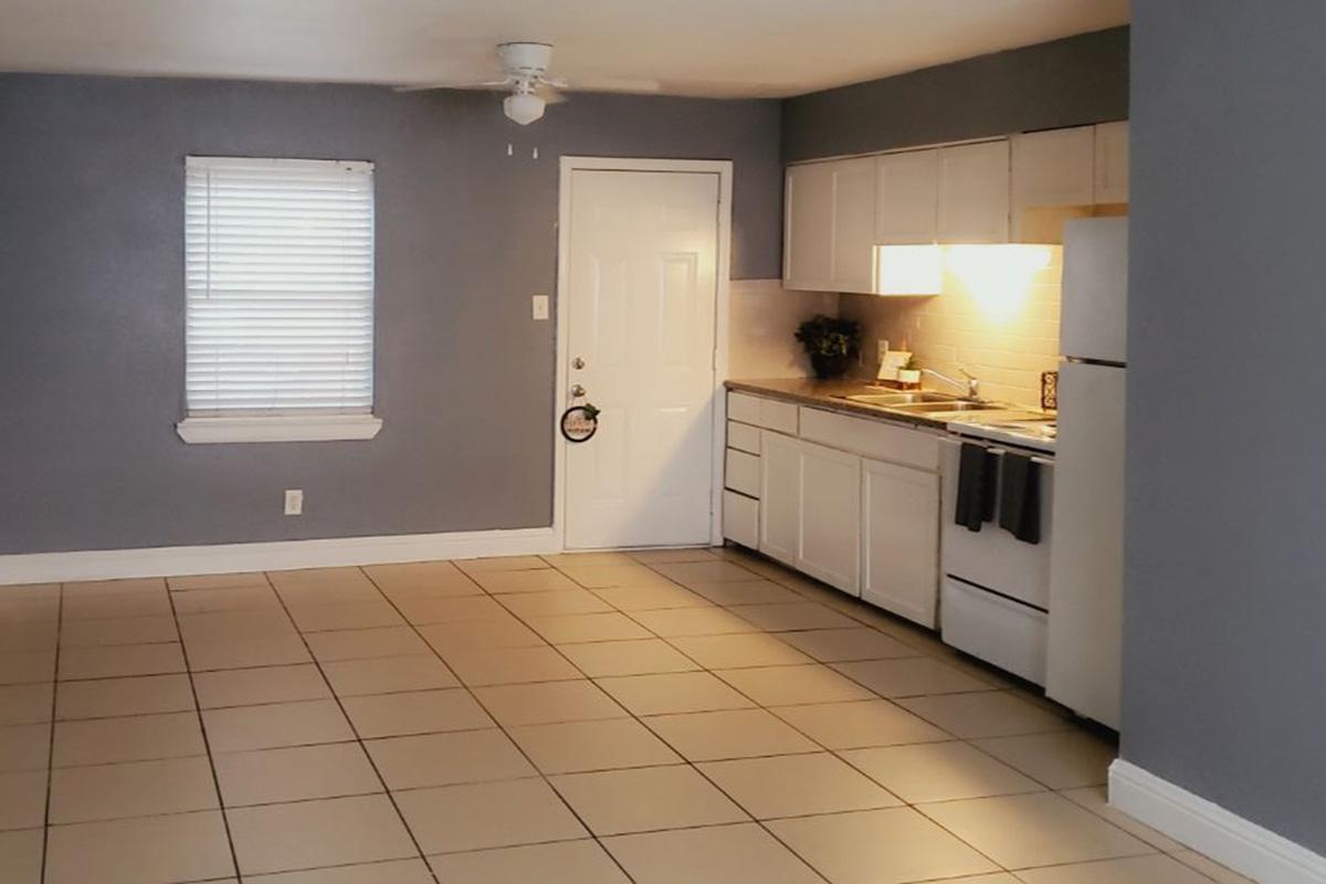 a kitchen with a tiled floor