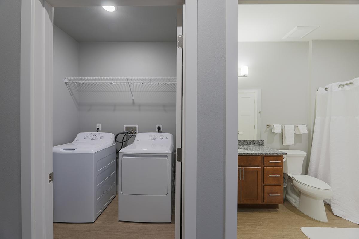 a room with a sink and a refrigerator
