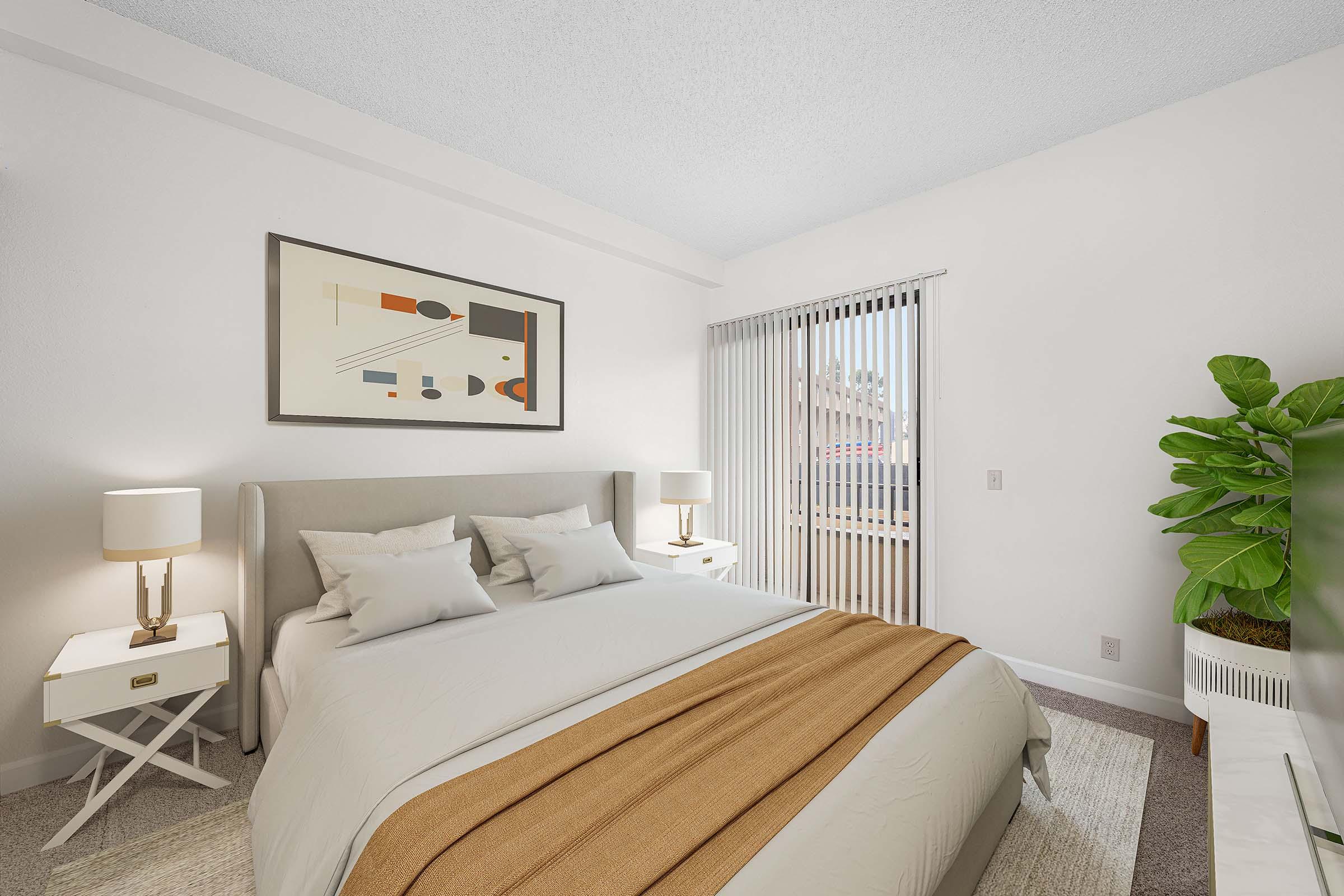 A bright, modern bedroom featuring a light-colored bed with a decorative throw blanket, two bedside tables with lamps, and an artwork on the wall. A large window with vertical blinds allows natural light to fill the space, and a green plant adds a touch of nature to the room.