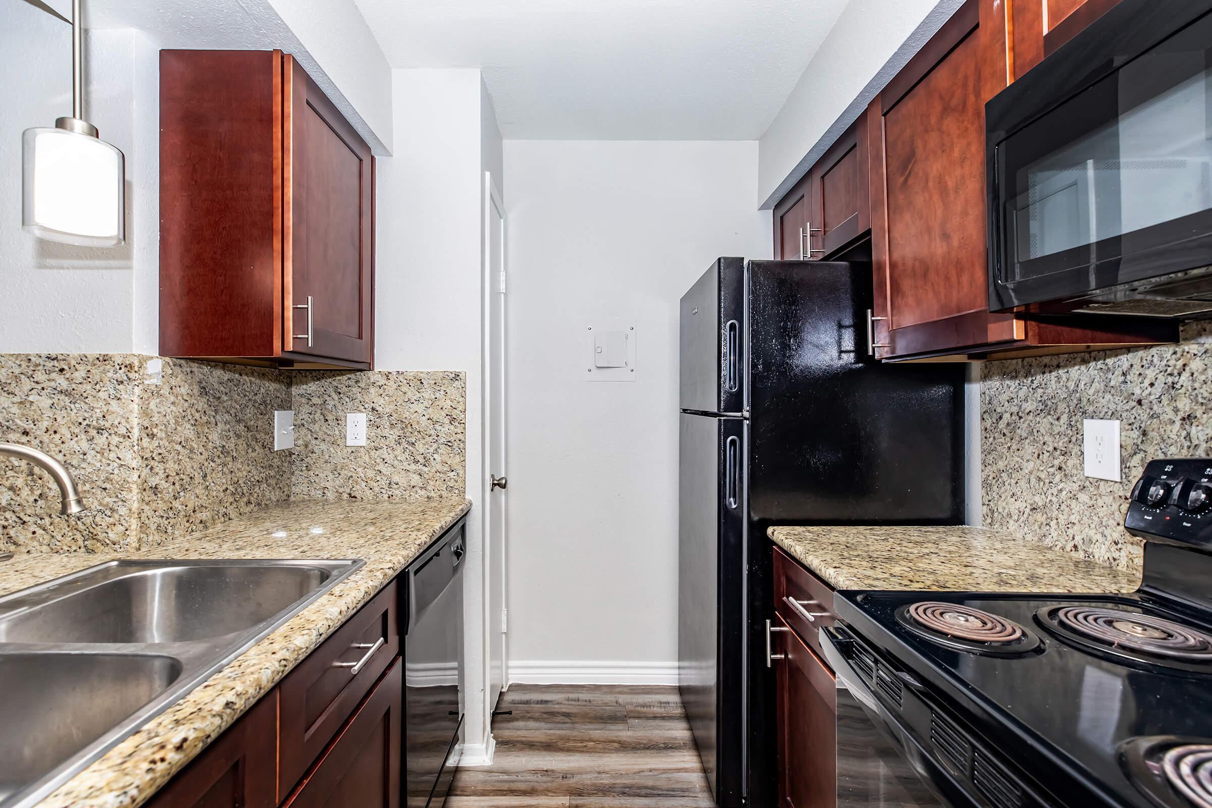 a kitchen with a stove top oven